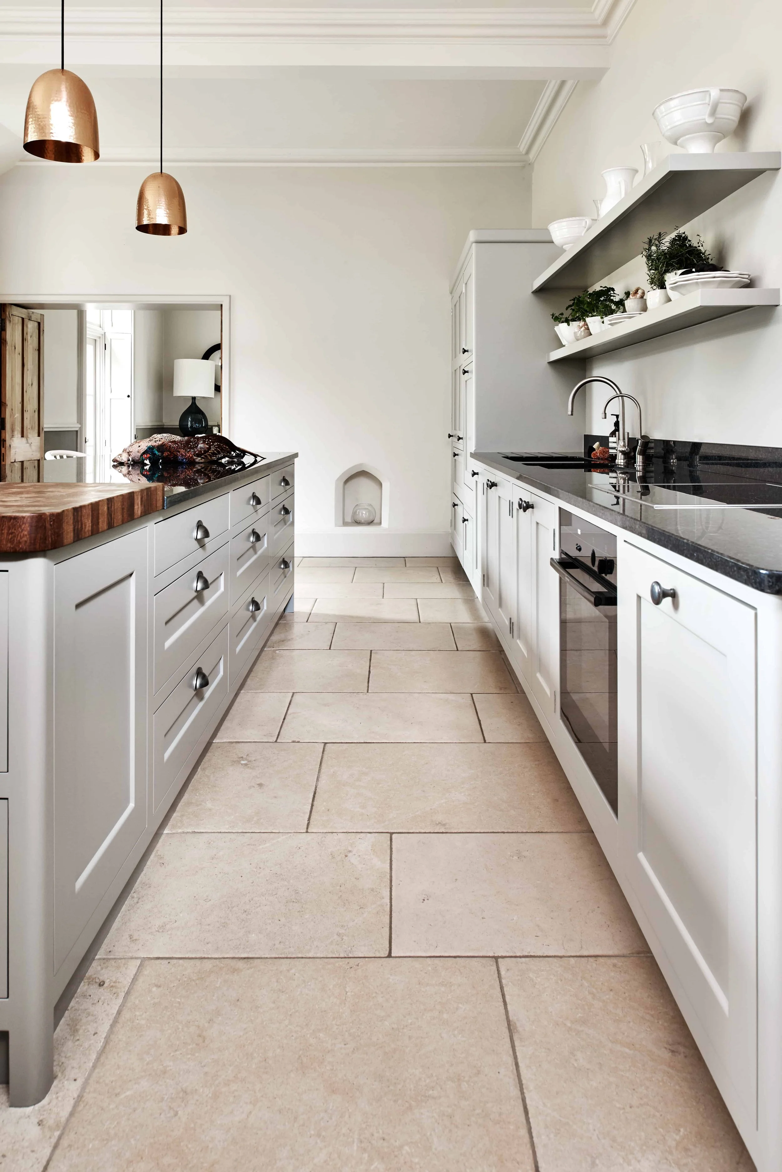 Run of handmade kitchen cabinetry in a Georgian-style Surrey kitchen design.
