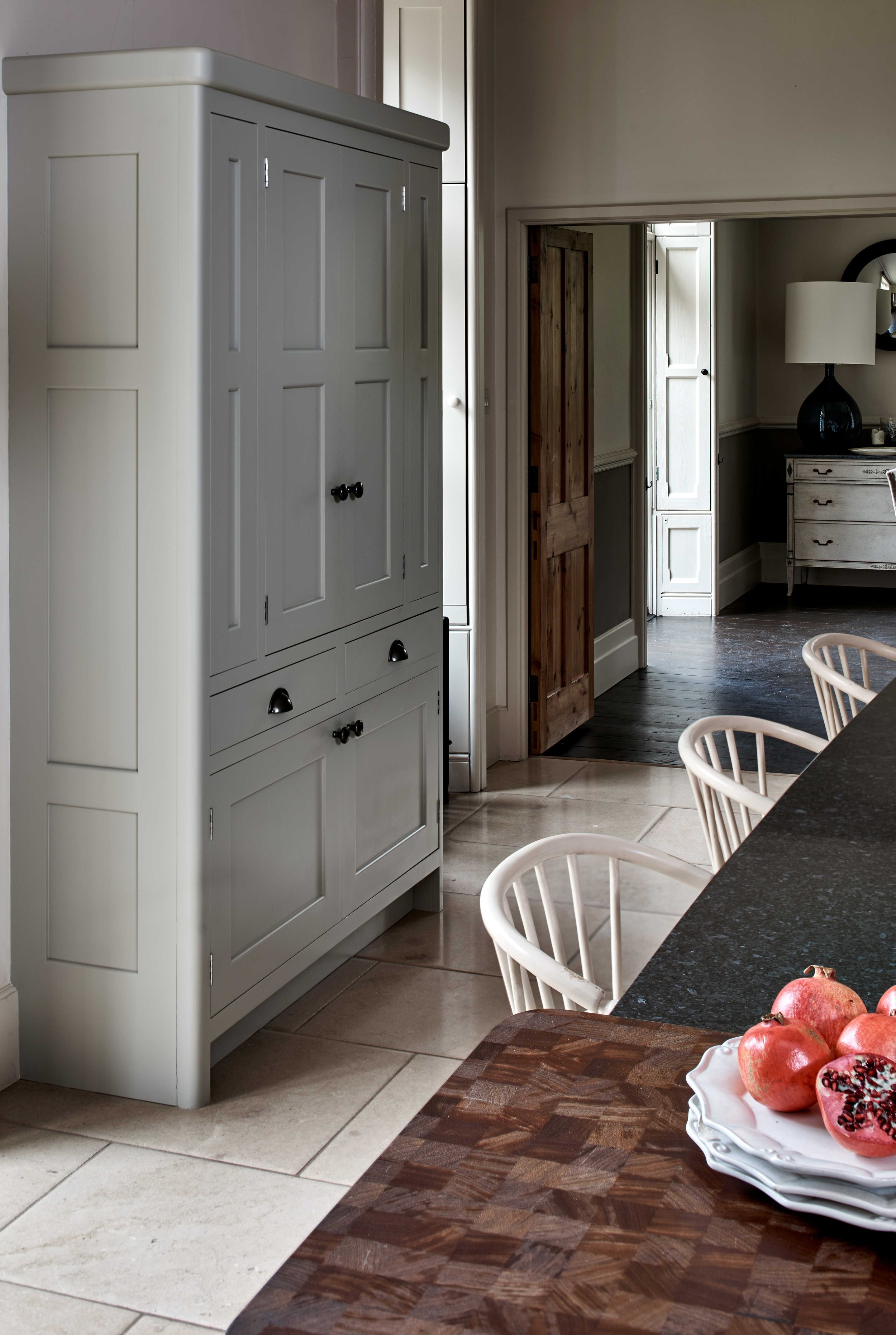 Hand-painted bespoke kitchen larder with traditional period detailing.