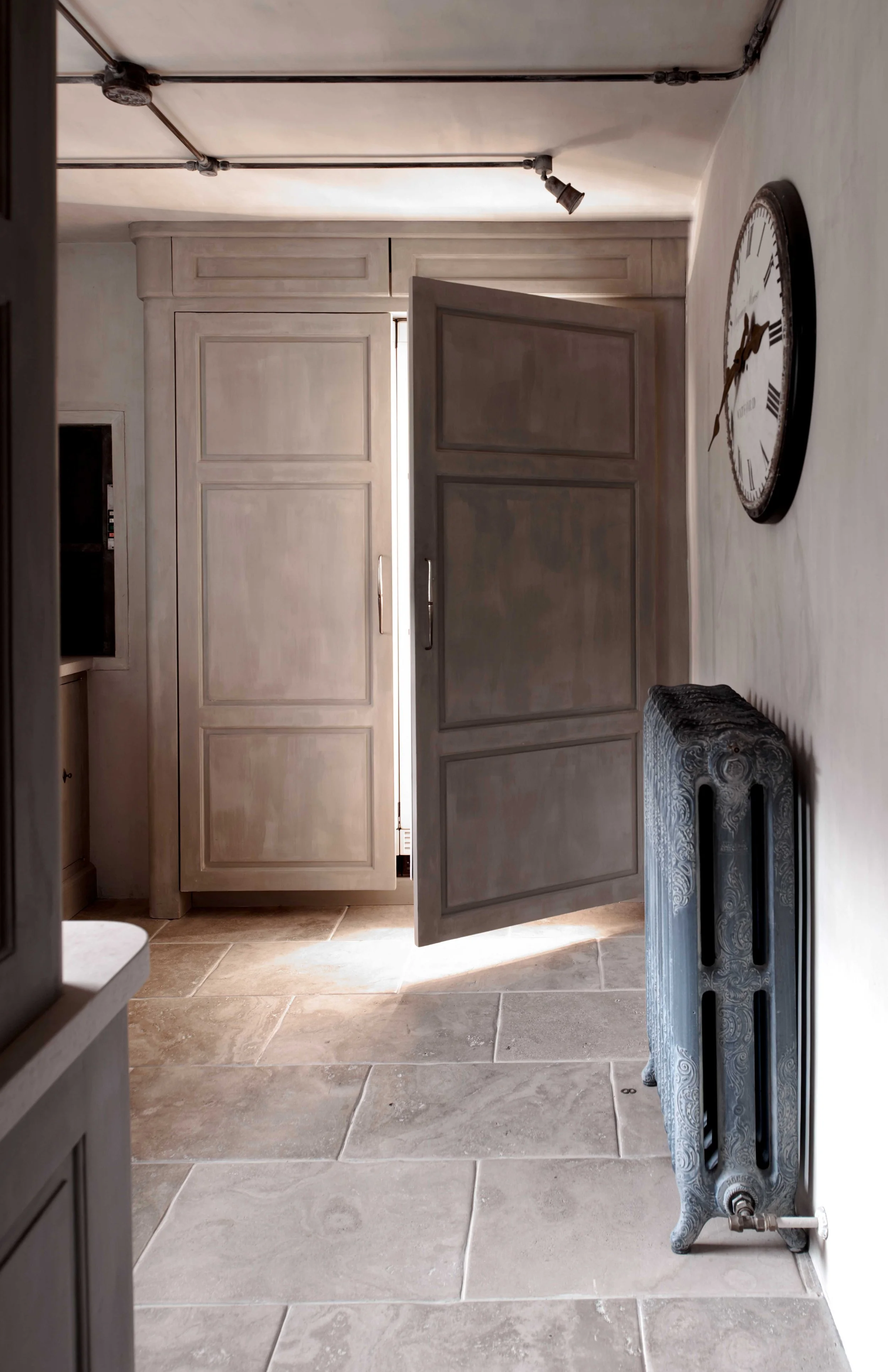 Handmade bespoke cabinetry housing large fridge freezer in Surrey ancillary kitchen.