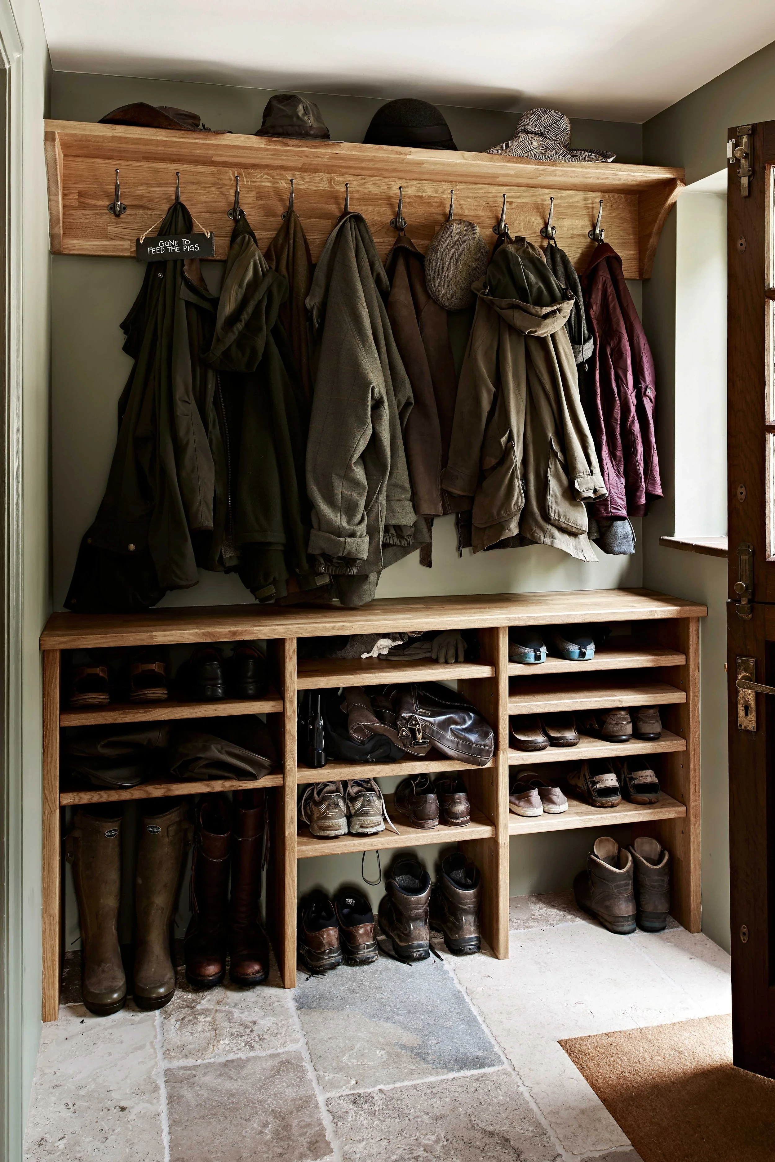 Handmade boot room storage for shoes, boots and coats in Surrey country house.