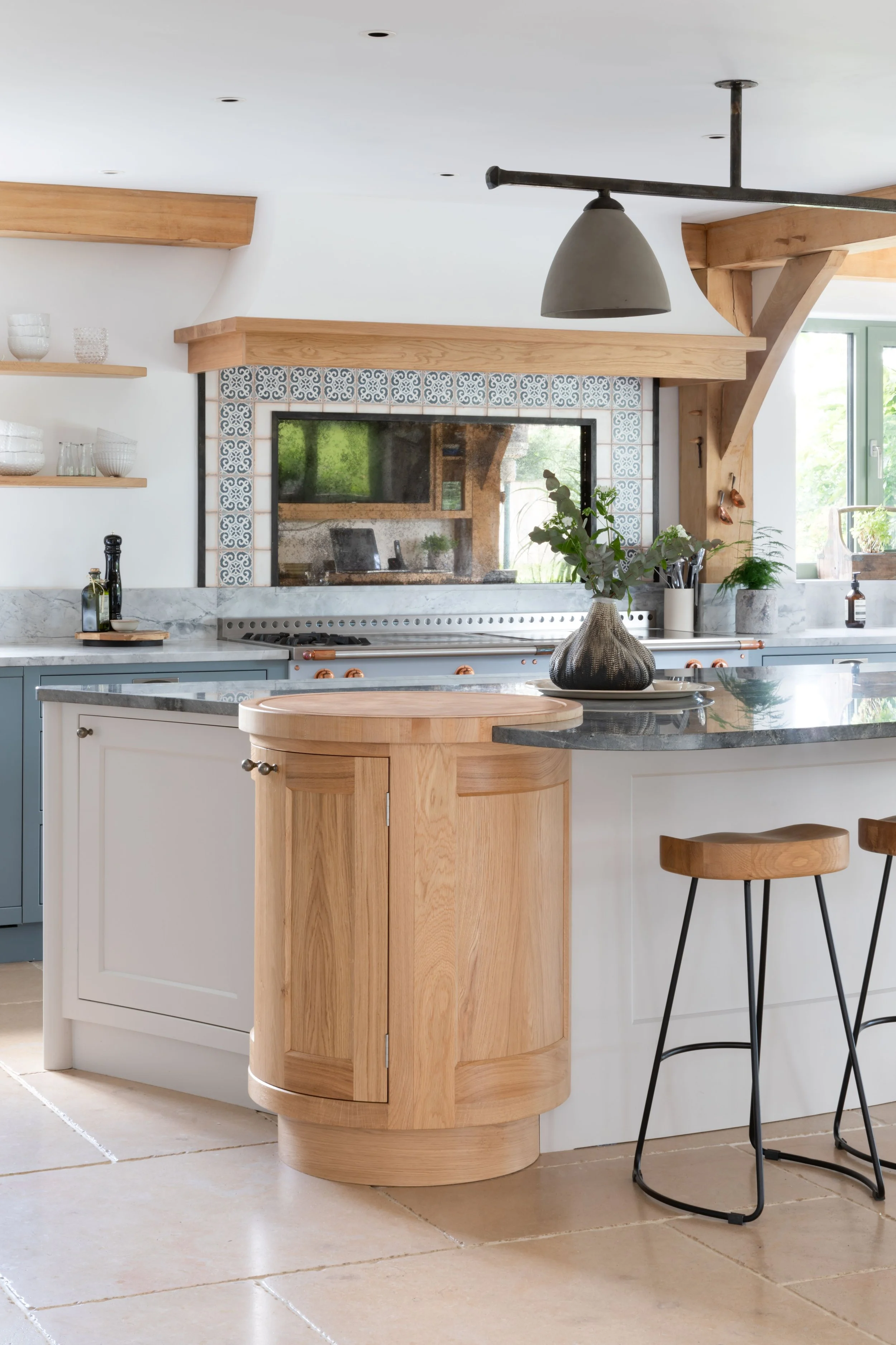 Handmade curved kitchen island with bespoke detailing in Guildford home.