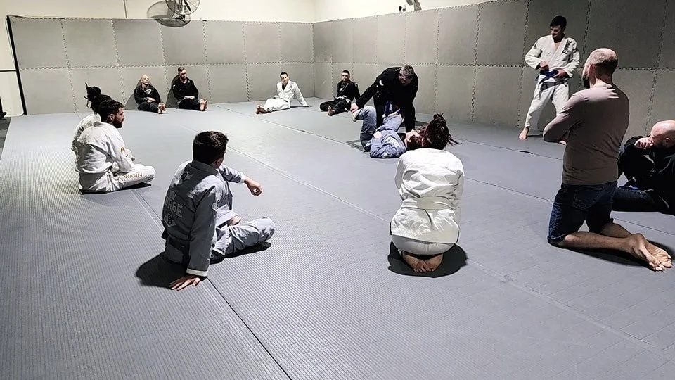 Coach's Nate and Geordie demonstrating open guard passing during a Monday night Gi class