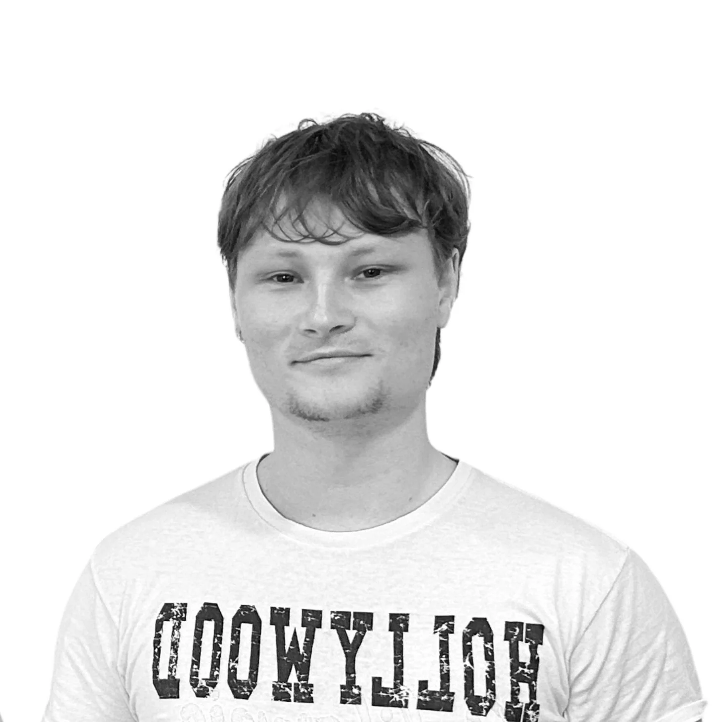 Black and white portrait of a young man with short, slightly wavy hair, wearing a t-shirt with partially visible text.