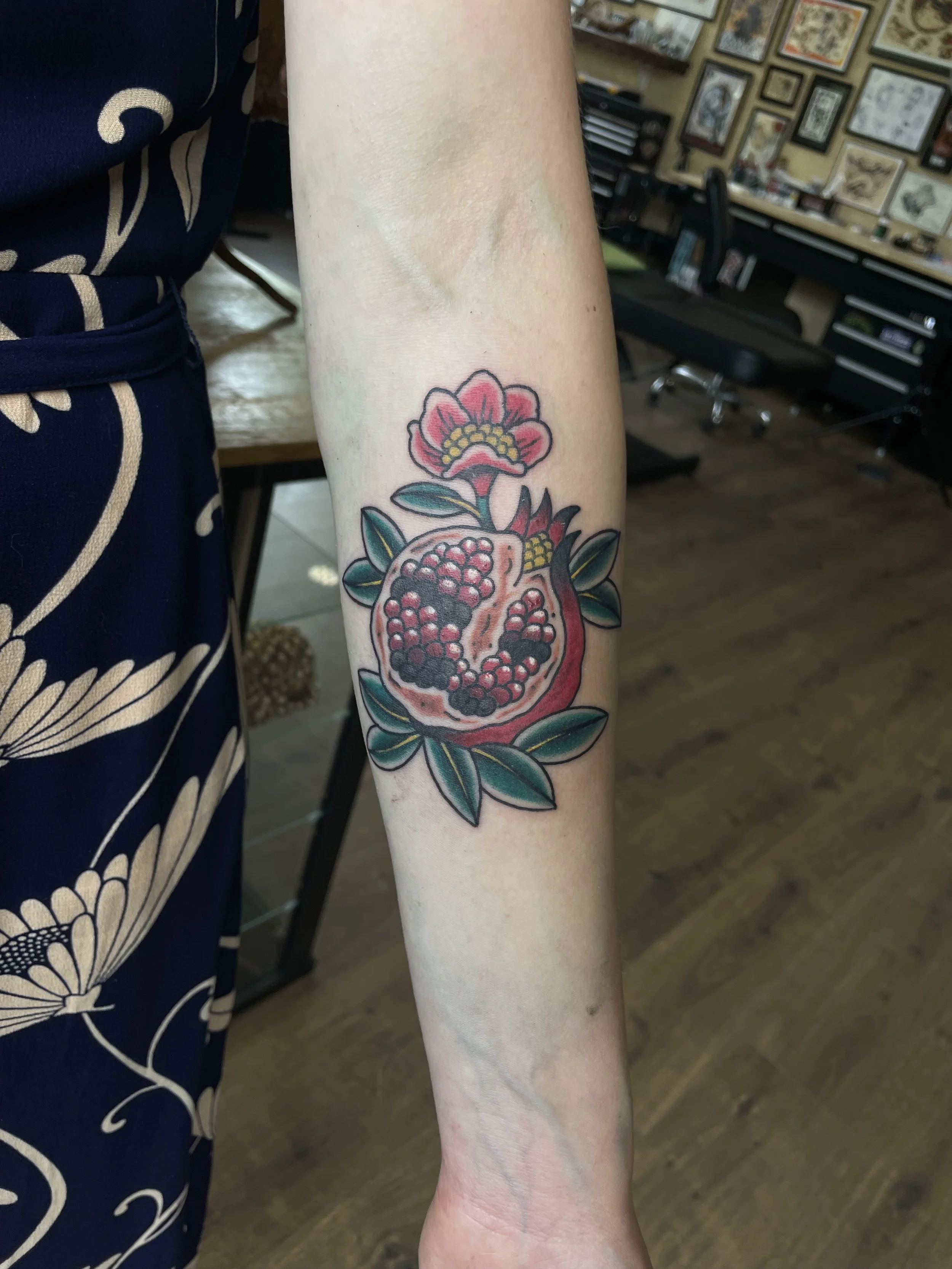 Traditional pomegranate tattoo.jpeg