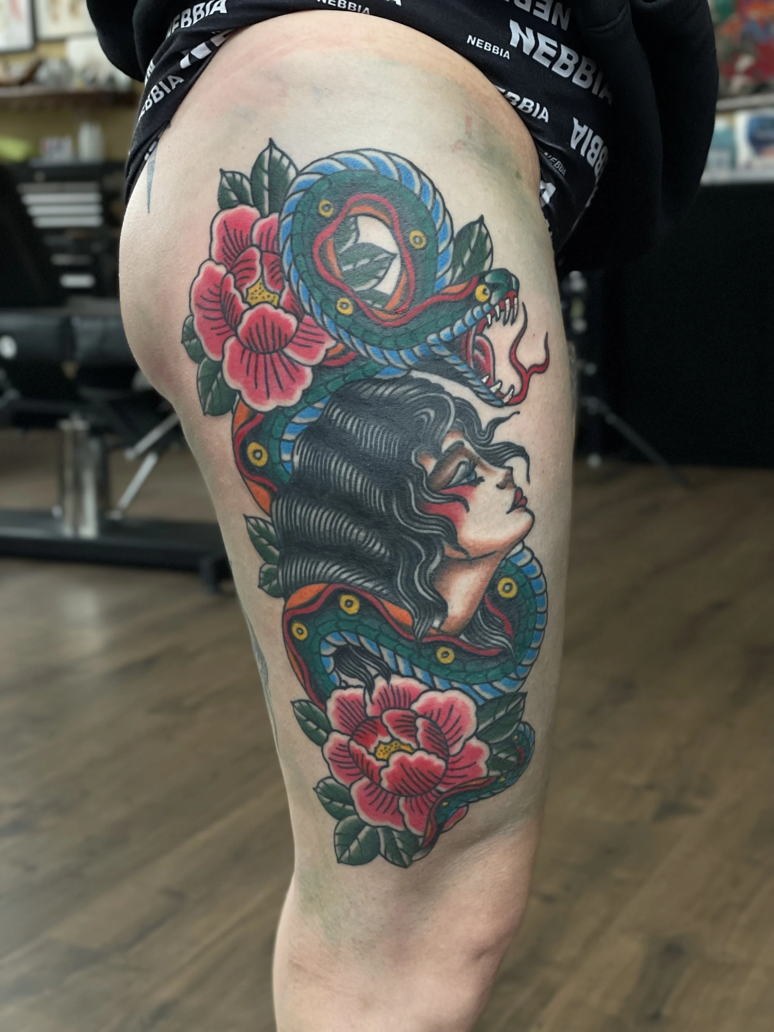 traditional lady snake tattoo.jpeg