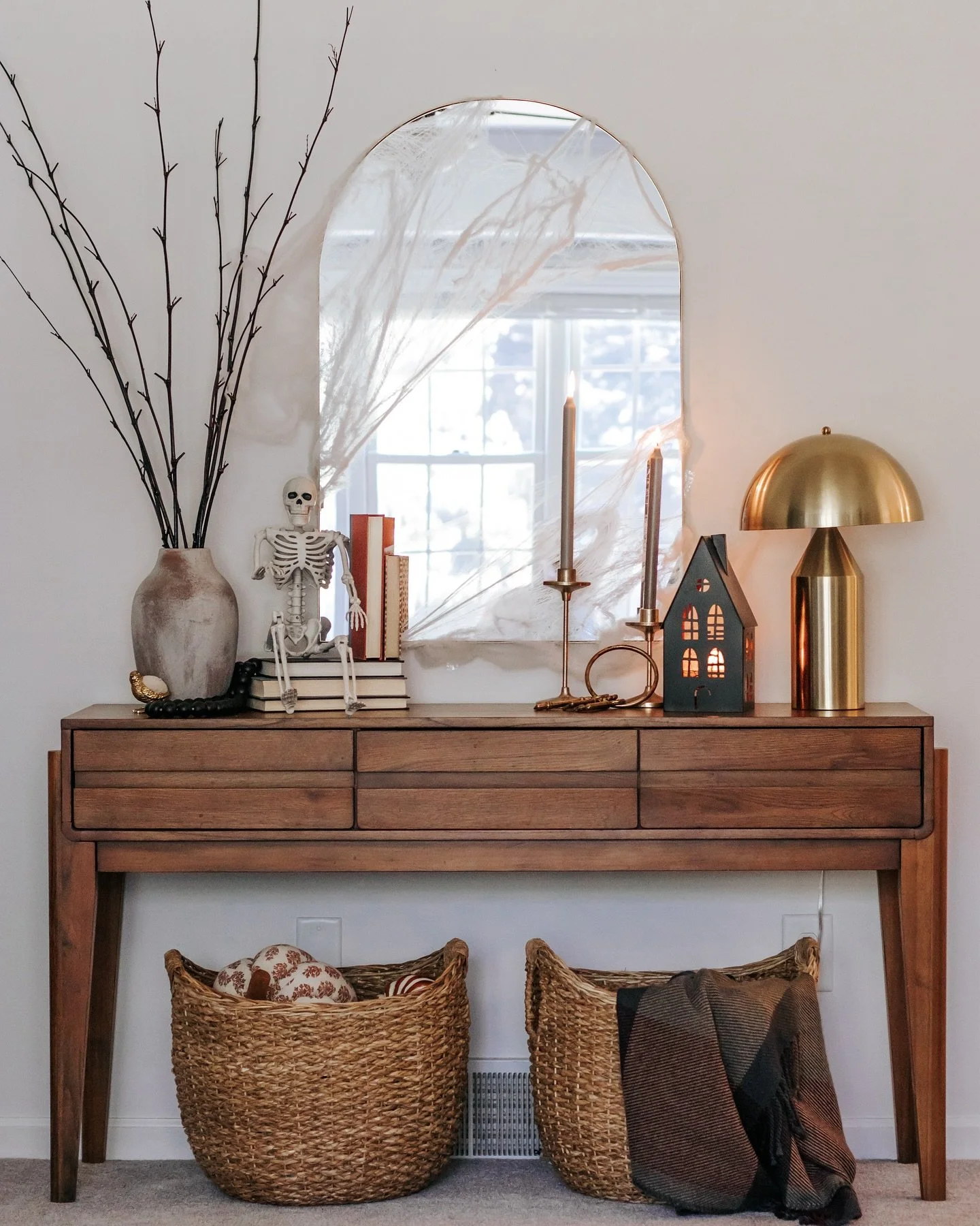 Happy Halloween! 🎃 Who says Halloween decor has to be all scares and spooks? We&rsquo;re keeping it stylish with just the right touches of seasonal charm. Cozy candles, soft pumpkins, and a hint of mystery make this console table perfectly festive. 