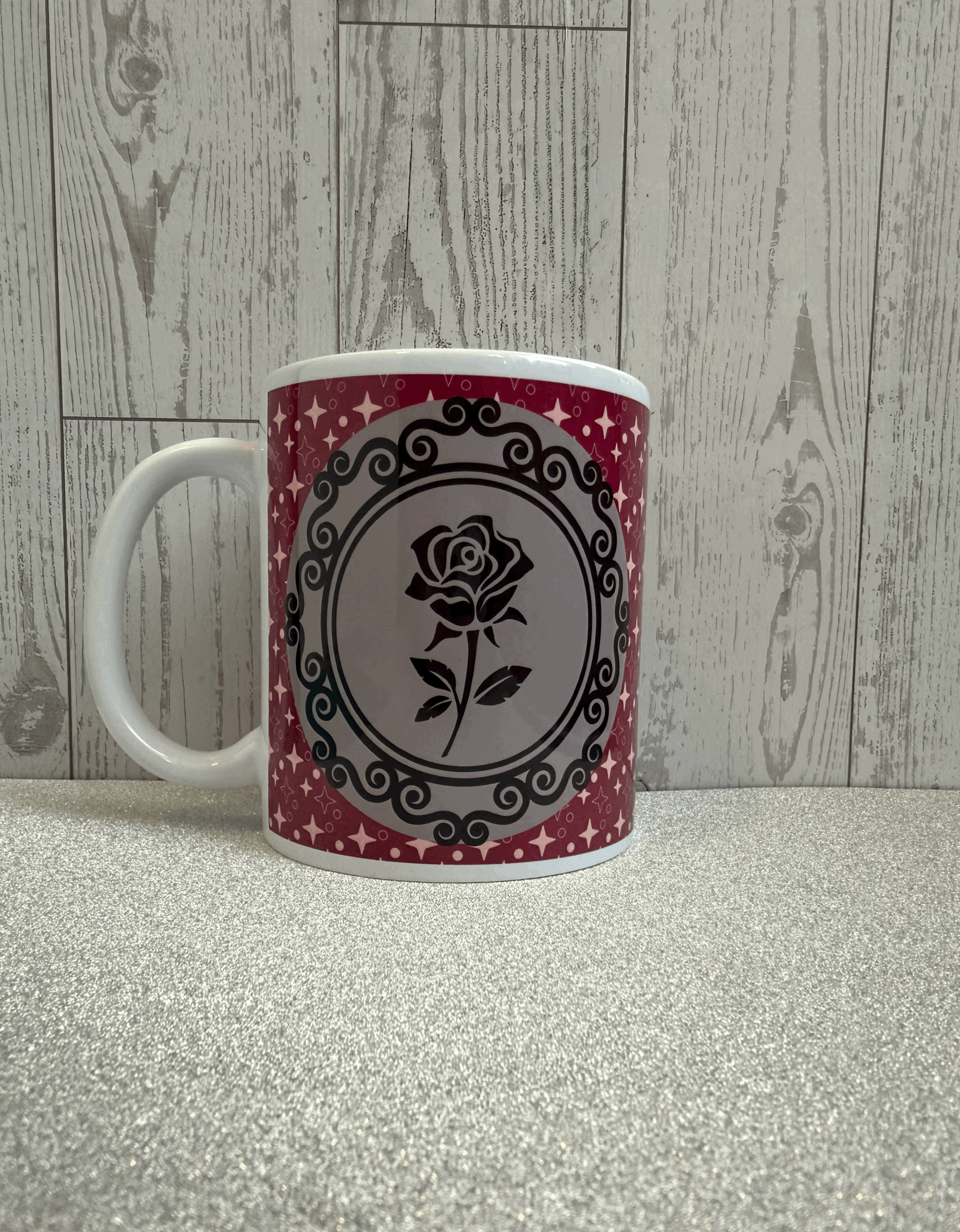 summer themed mug with a gothic inspired framed image of a rose on a dark pink sparkly backdrop.gif