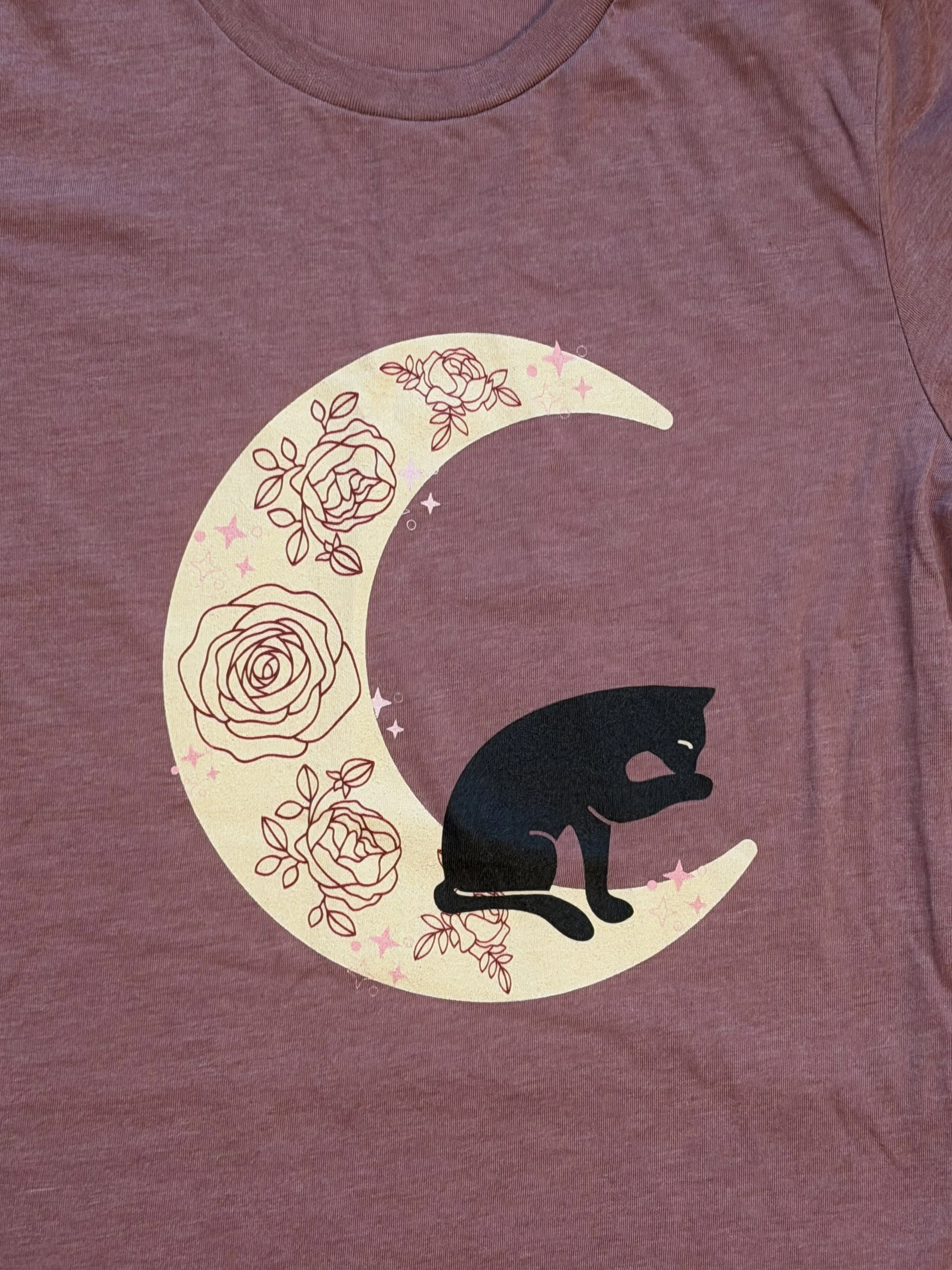 Close up cat and crescent moon summer and roses.jpeg
