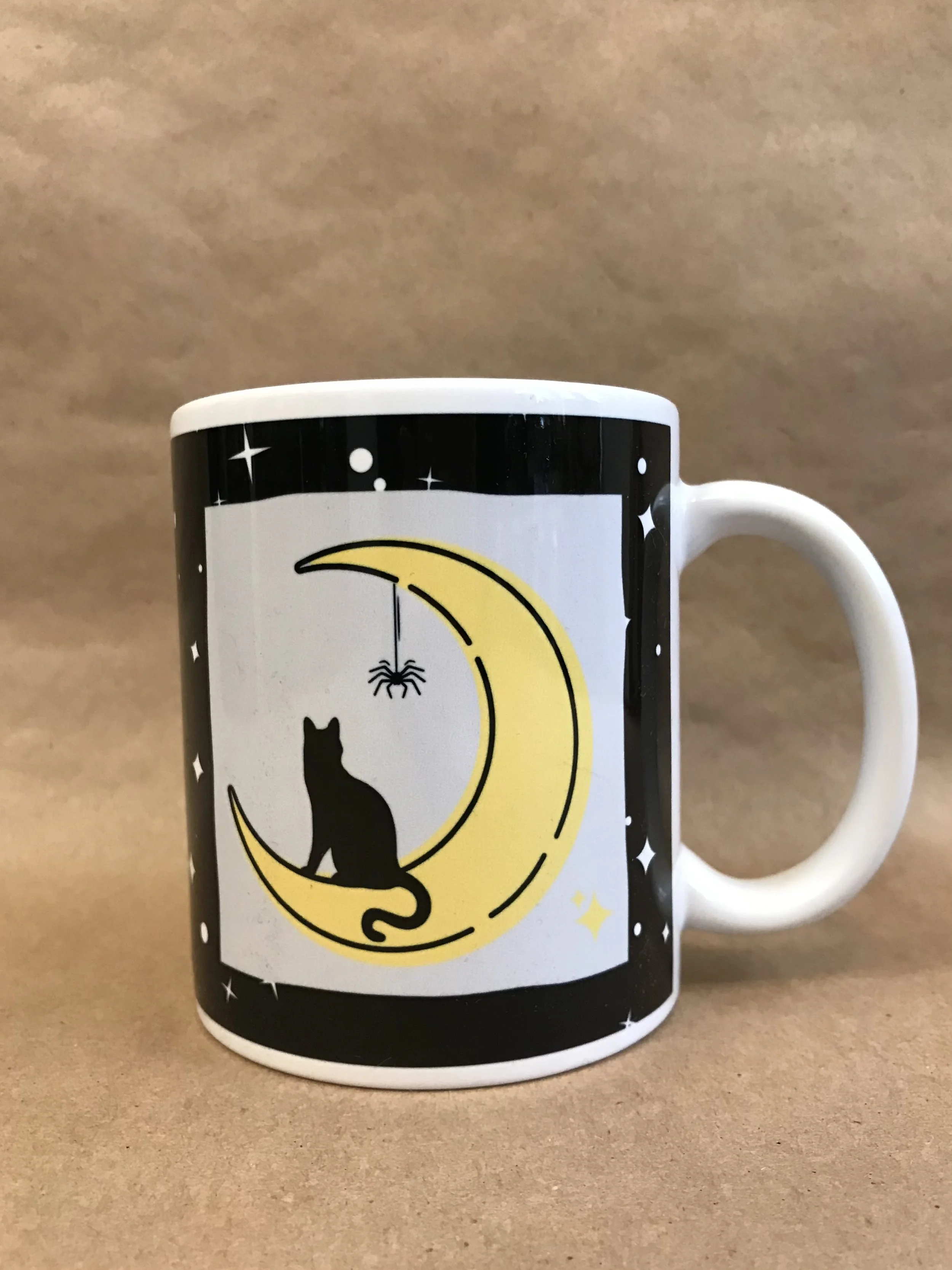 Black Cat on yellow crescent moon with dangling spider.jpeg