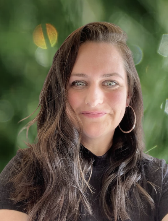 Headshot of Jennifer Vincent, LMHC, smiling confidently in a bright, welcoming setting.