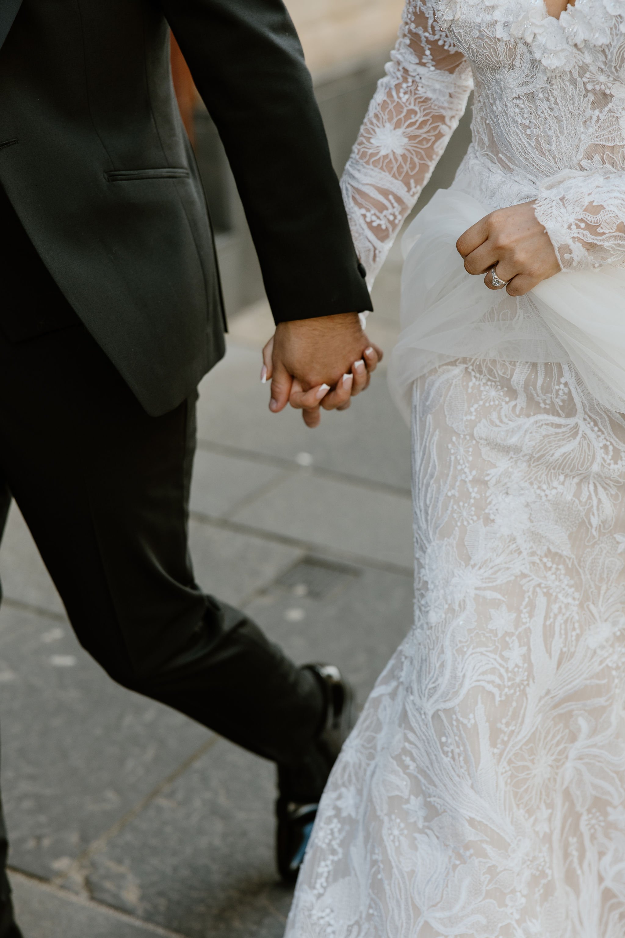 The couple is walking together in Glasgow city centre for their couple photoshoot