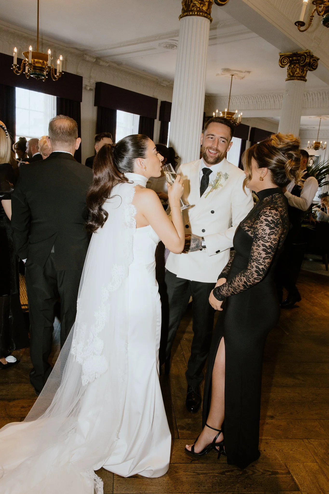 Candid photo of the bride and groom with guests