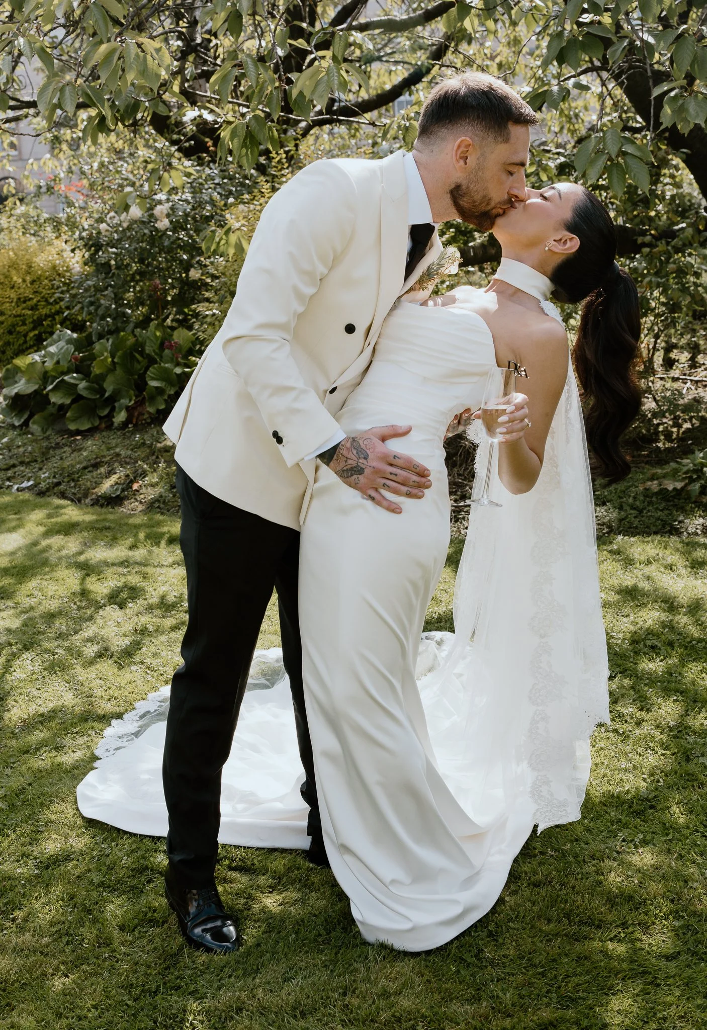 The groom is kissing the bride