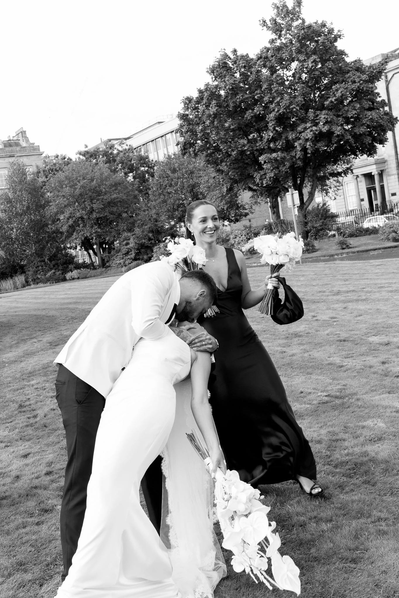 Candid photo of the groom kissing the bride