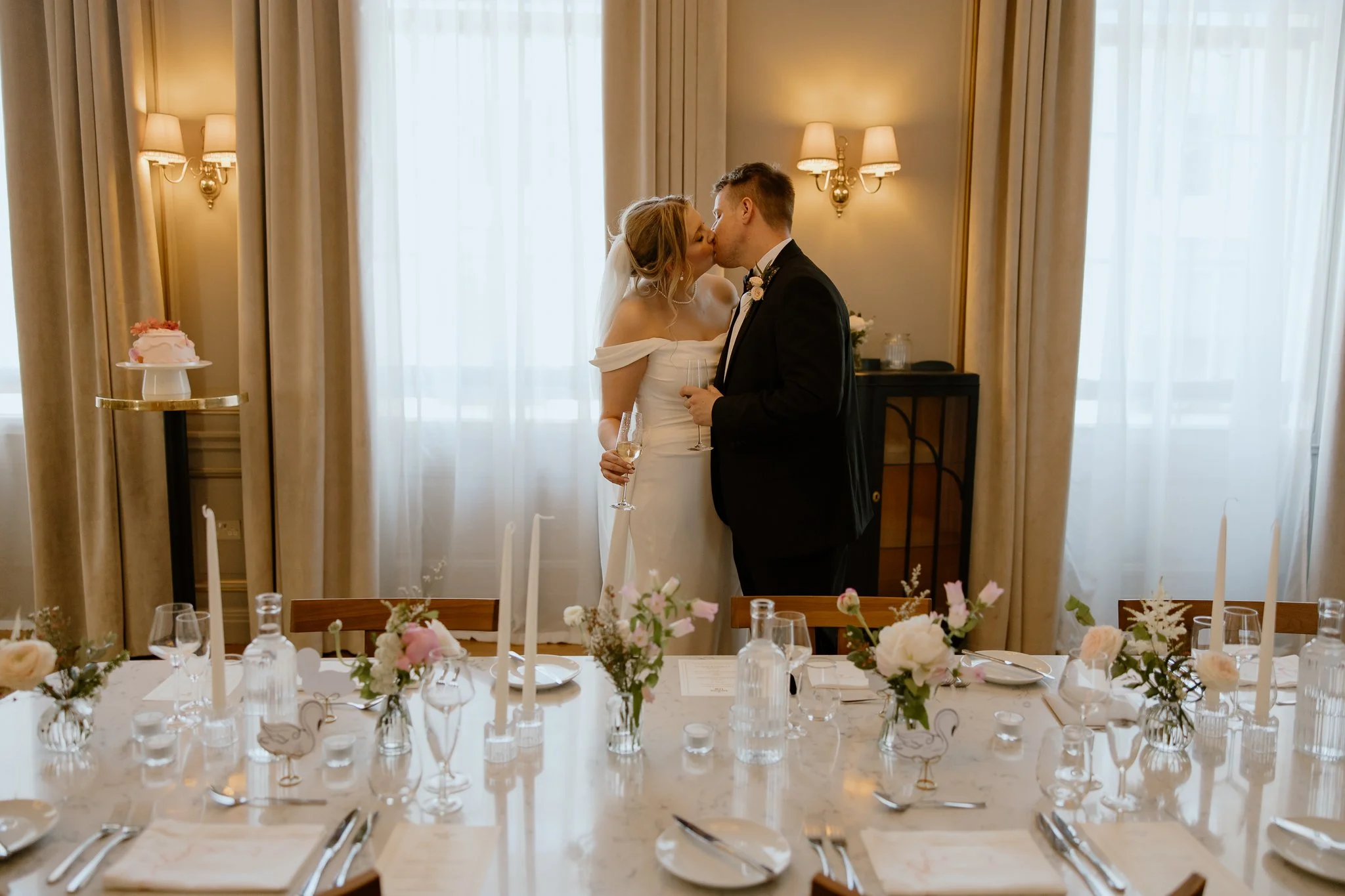 The couple kiss in the dinning room at Cheval the Edinburgh Grand.