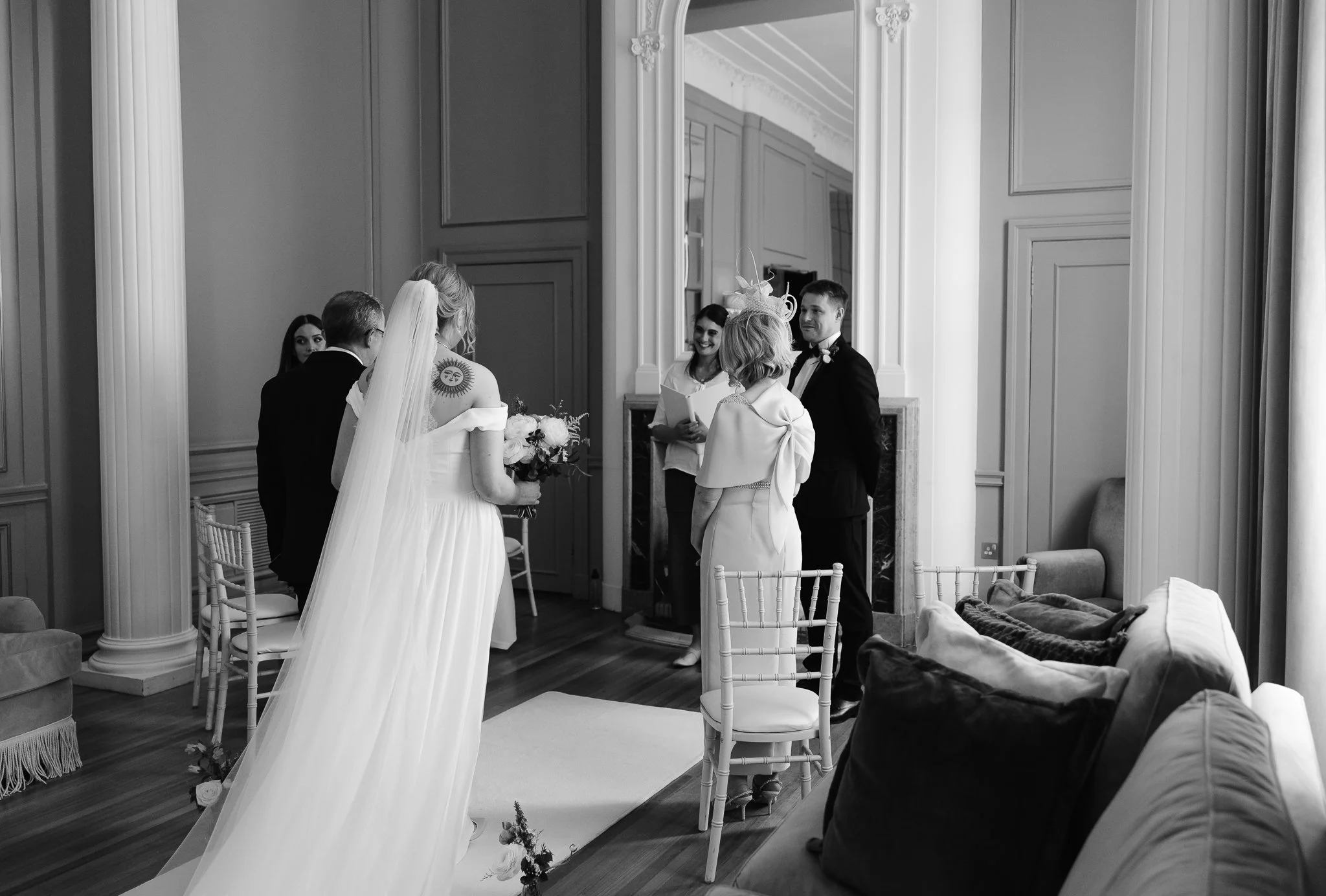 The bride walked by her father and the groom is seeing her for the first time