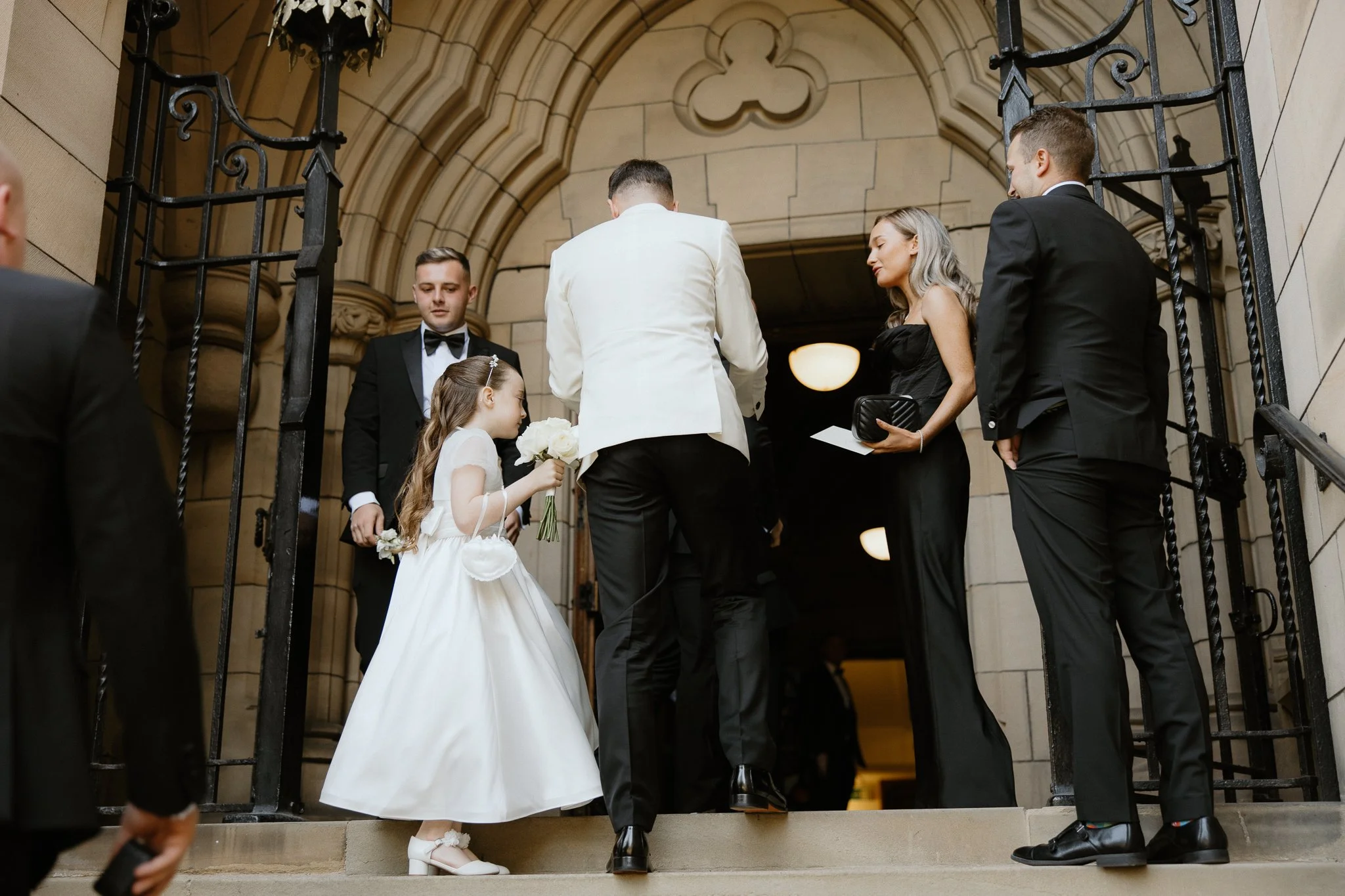 Candids moments of the groom meeting the wedding guests