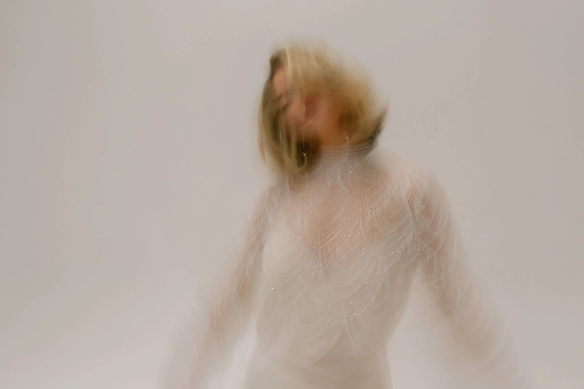 The blurry photo of the bride in Catherine Dean beaded bridal top