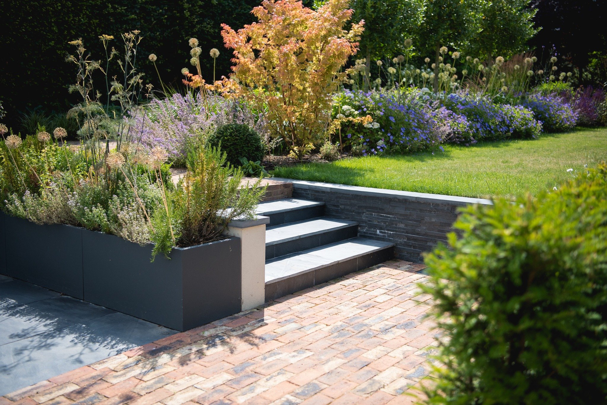 This space is a great example of what can be achieved when every part of the garden is considered with intent.

Defined entertaining zones, varied planting heights, and subtle elevation changes give this garden both function and atmosphere.

What wou
