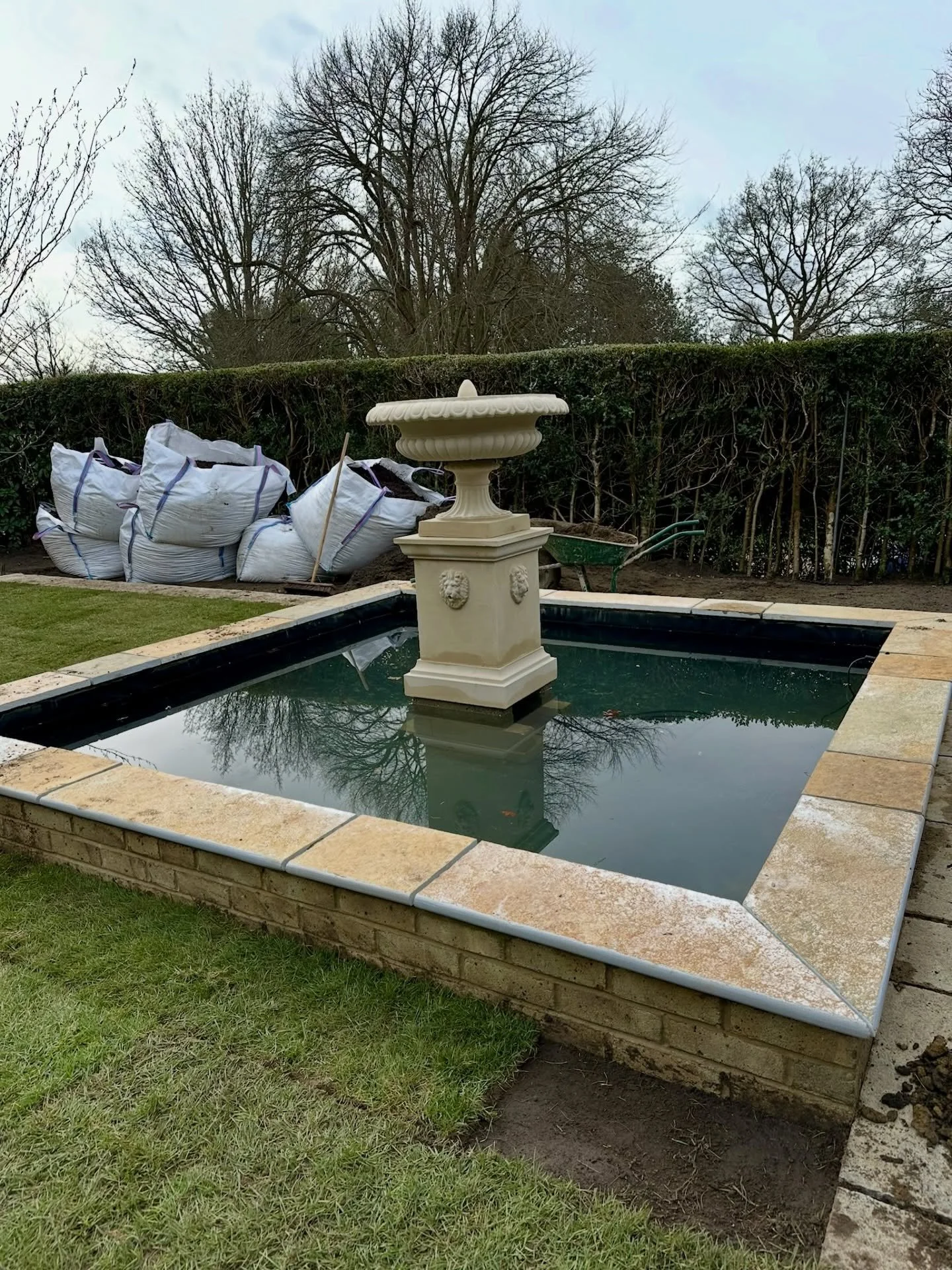 A timeless addition to a truly special setting.

This bespoke water feature was carefully designed and built to sit seamlessly within a Grade II* listed property &mdash; complementing the character, tones and texture of the existing sandstone house. 