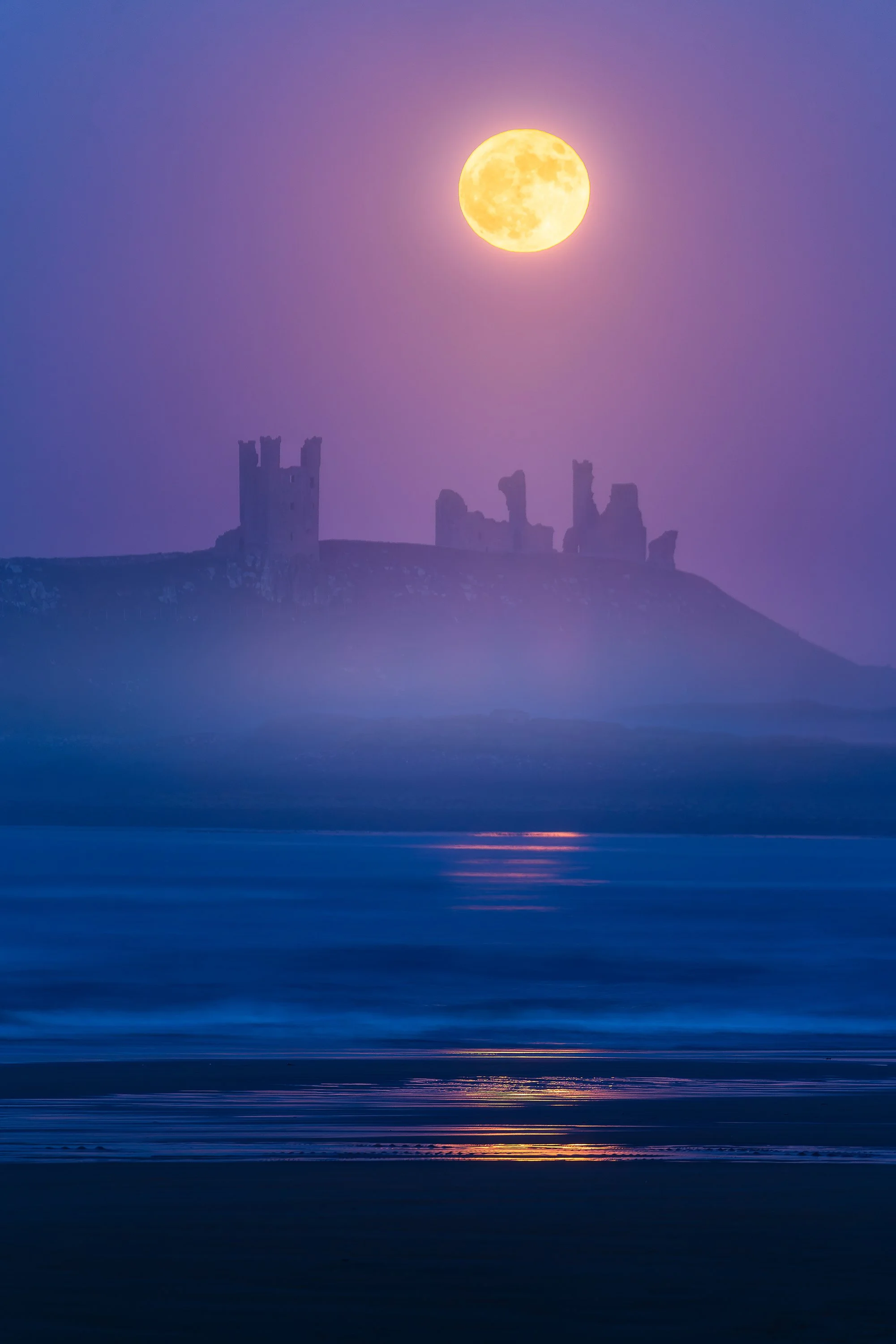 Dunstanburgh Castle moonrise May_.jpg