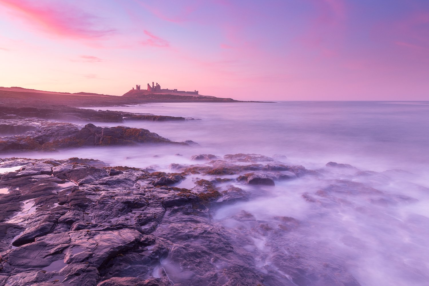 Summer sunset at Dunstanburgh Castle