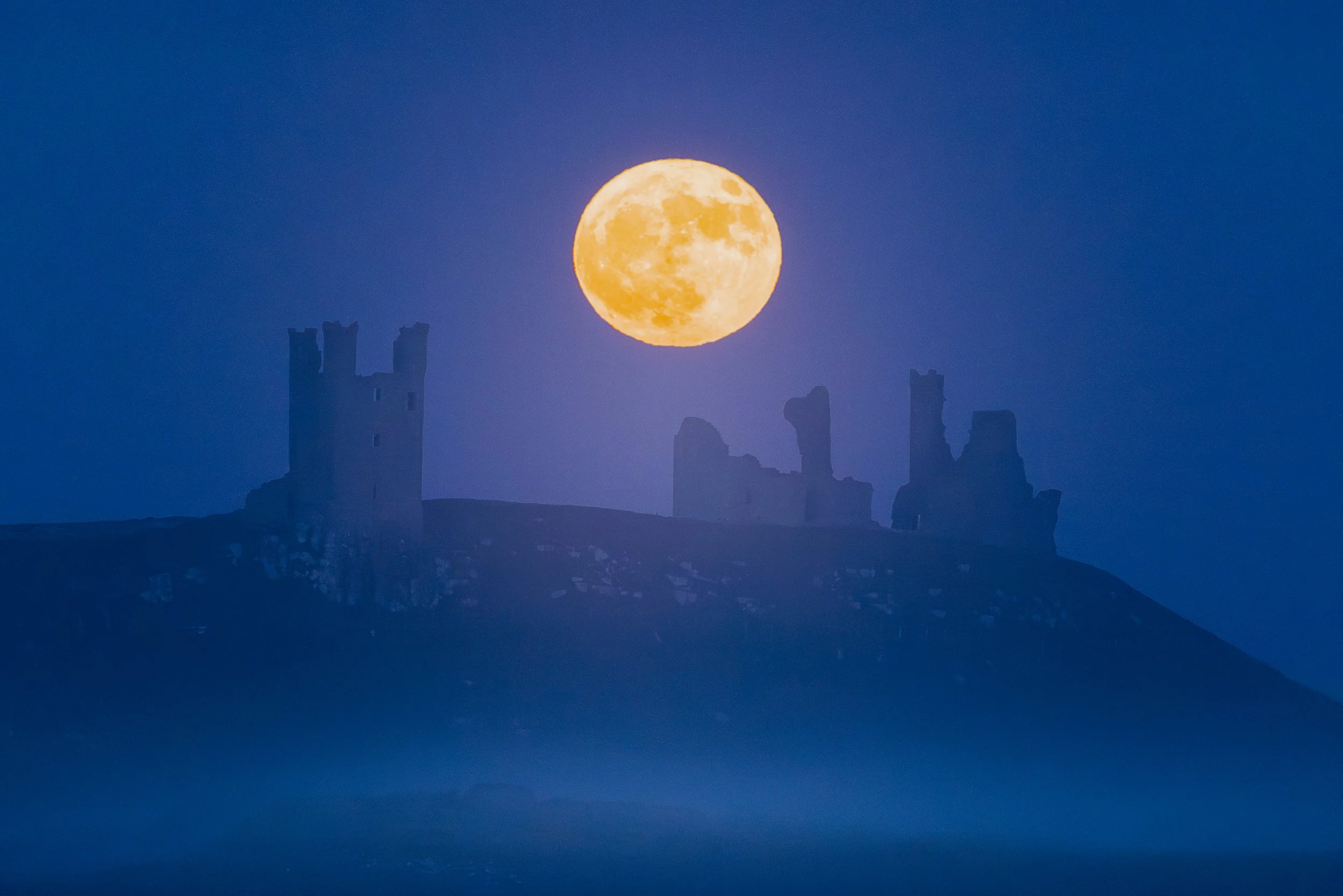 Dunstanburgh Castle May the Flower Moonrise_.jpg