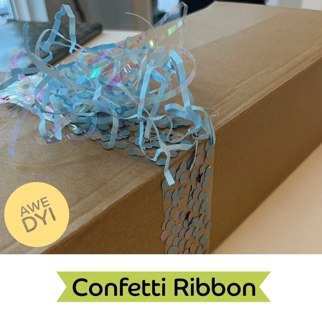 DIY Confetti Ribbon! 🎀✨ Add a pop of creativity to your holiday wrapping this season!

1️⃣ Grab a hole punch (or any small punch tool) and create a bunch of colorful confetti! 🌈✂️
2️⃣ Lay clear packing tape sticky side up. 🪄
3️⃣ Sprinkle the confe