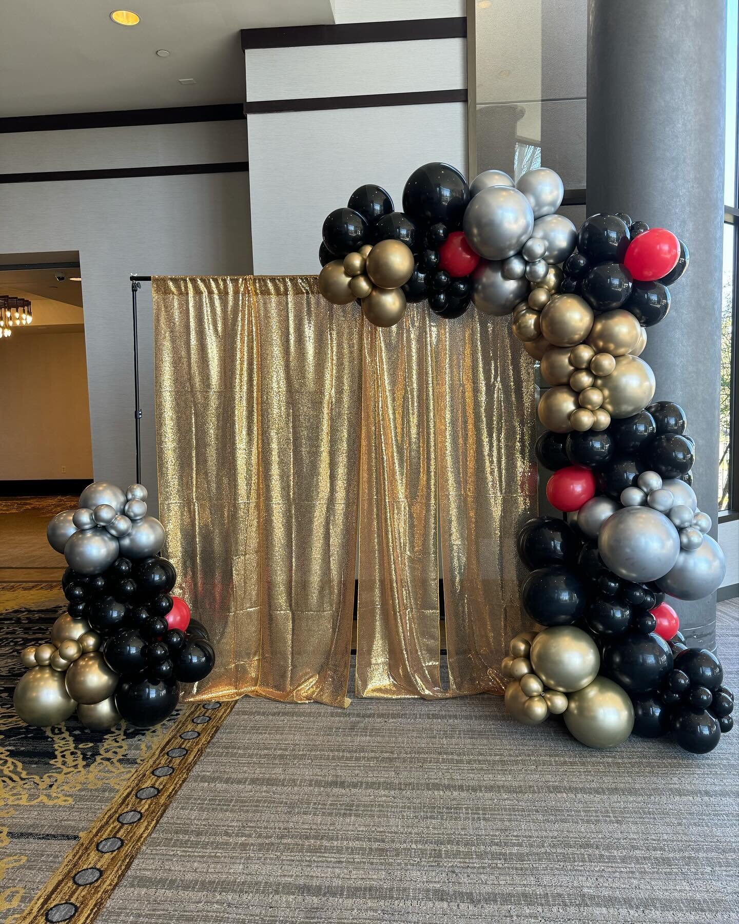 The balloon drop was strung with great care for a special birthday surprise that will go off over the dance floor!
We added balloon garland to their backdrop to make pictures pop!