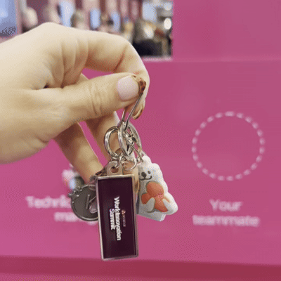 A gif of an Asana branded keychain