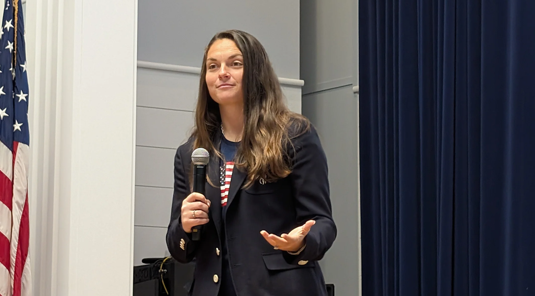 Noelle Lambert speaking at a school