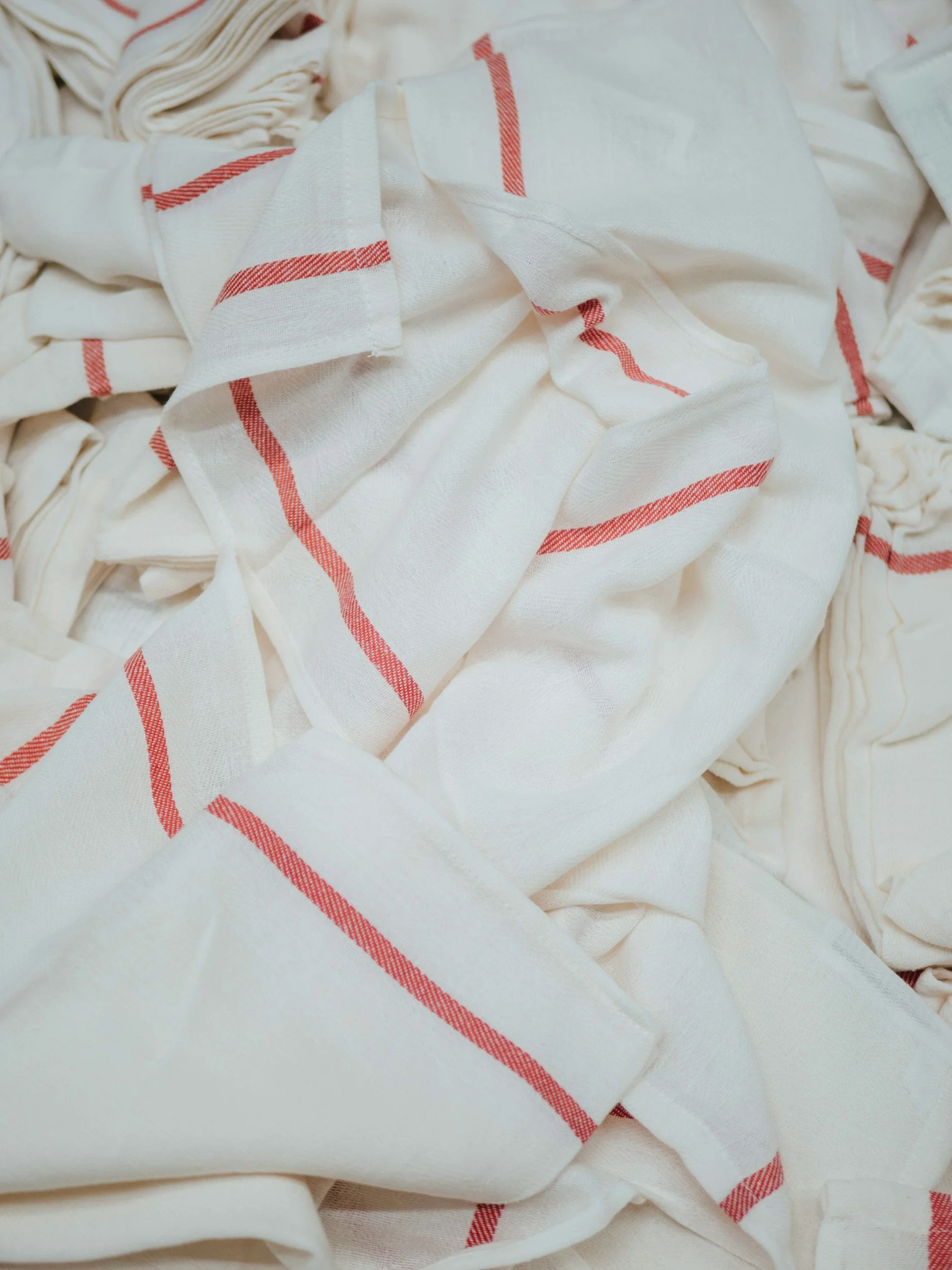 Pile of clean, white rags with a red stripe