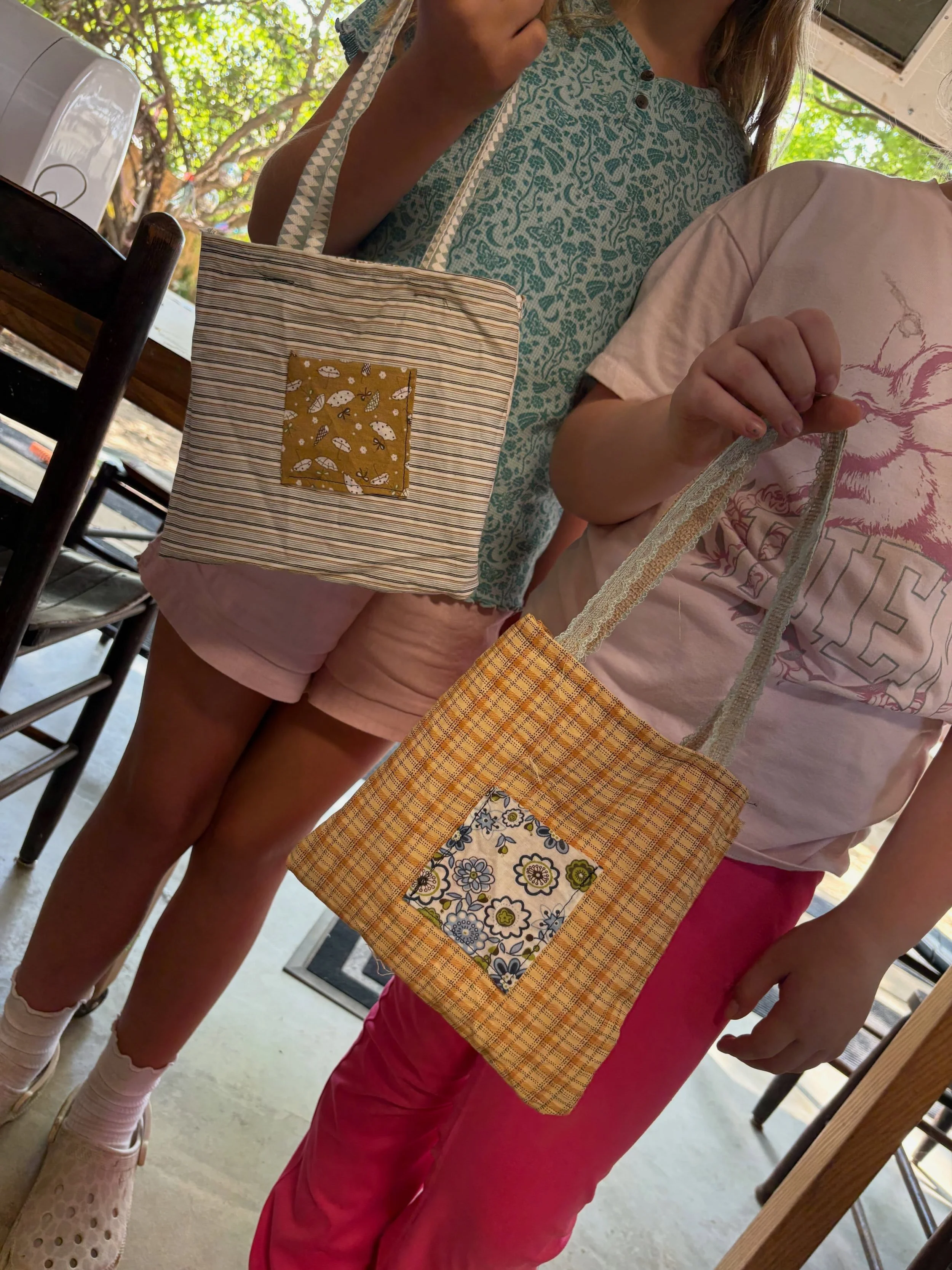 so so proud of these gals!! not only did they spend their free time helping the littler birdies tie off stitches, sew on buttons, thread needles, and generally acting as the seamstress fairies of the day, they asked if they could jump on the ✨machine