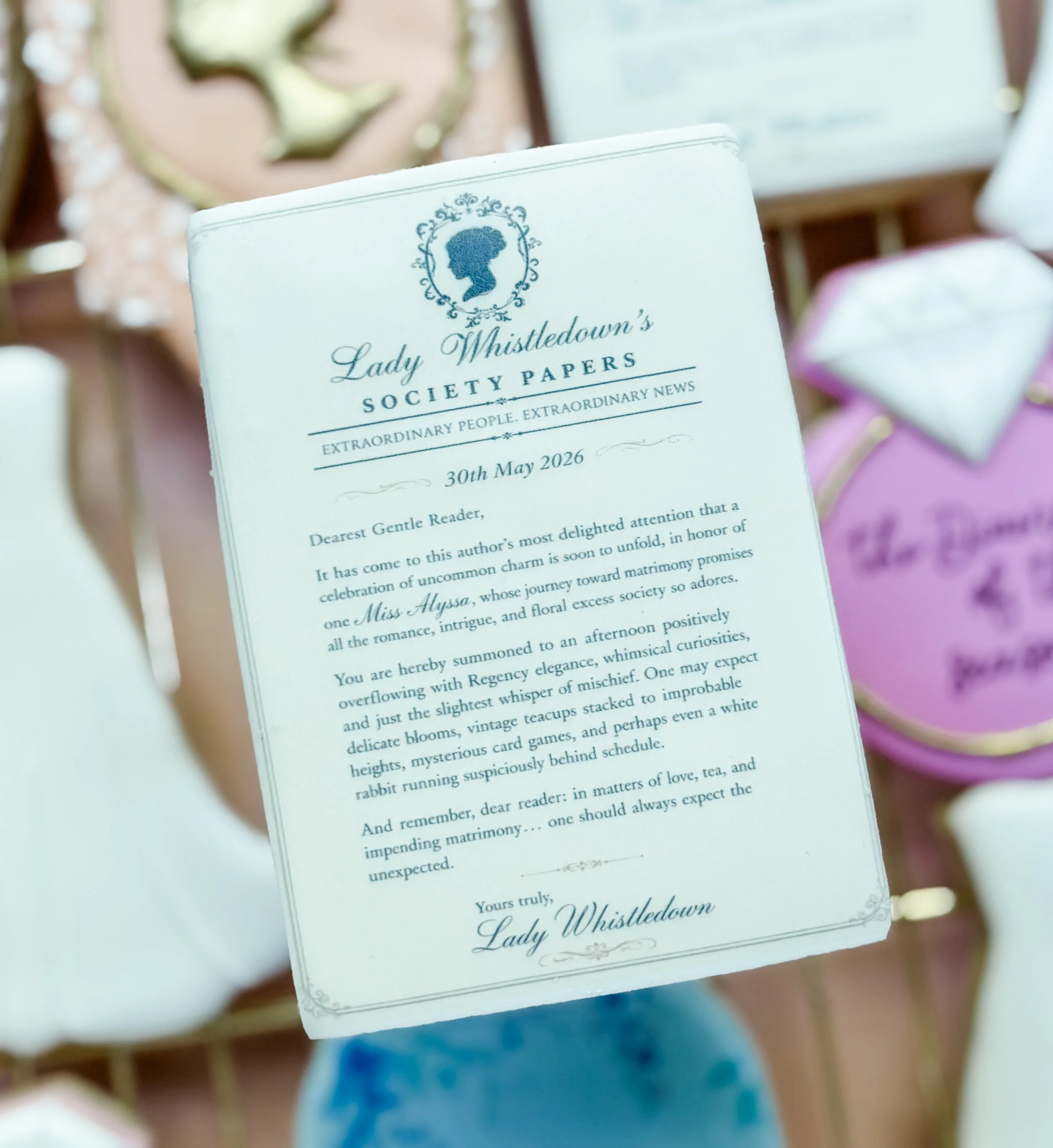 A wedding invitation card featuring a silhouette of a woman's profile inside a decorative frame with floral elements, announcing a wedding at Lady Whistledown's Society Papers on May 30, 2026.