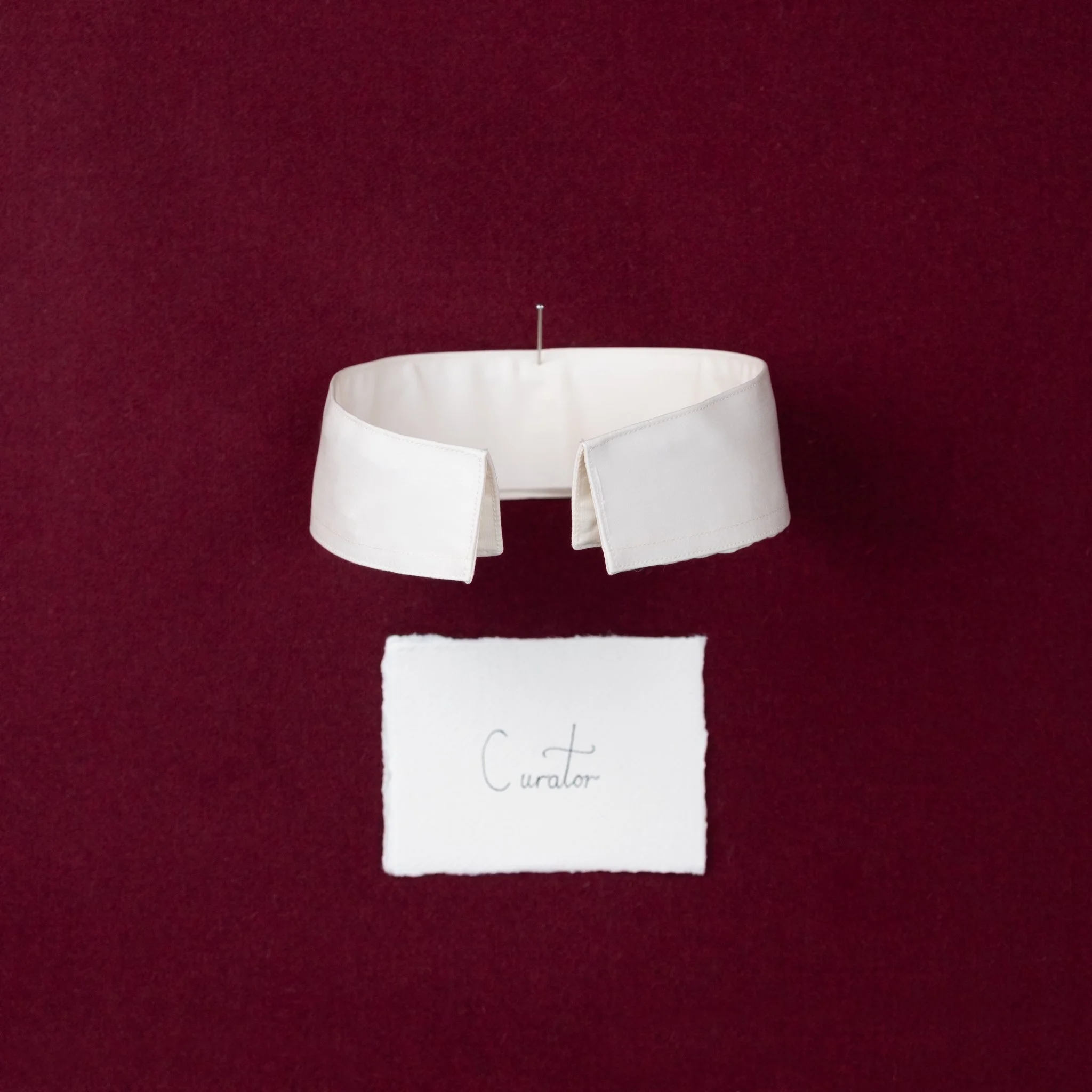 Curator,
This is a spin on the stand collar or the
Nehru collar. The inverted band offers
something quite different in comparison
to the other options available. This makes
it the perfect choice for an architect or
designer, or someone with quirky ye