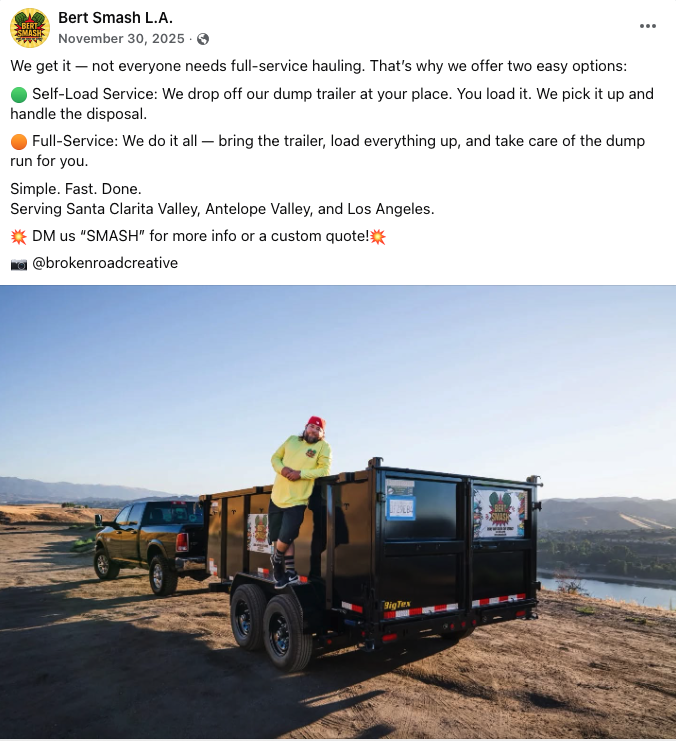 A man standing on a black dump trailer with a yellow and red logo, holding onto the side, with a black pickup truck attached behind it, in an open outdoor. Social media content creation for a small business launch is what's shown.