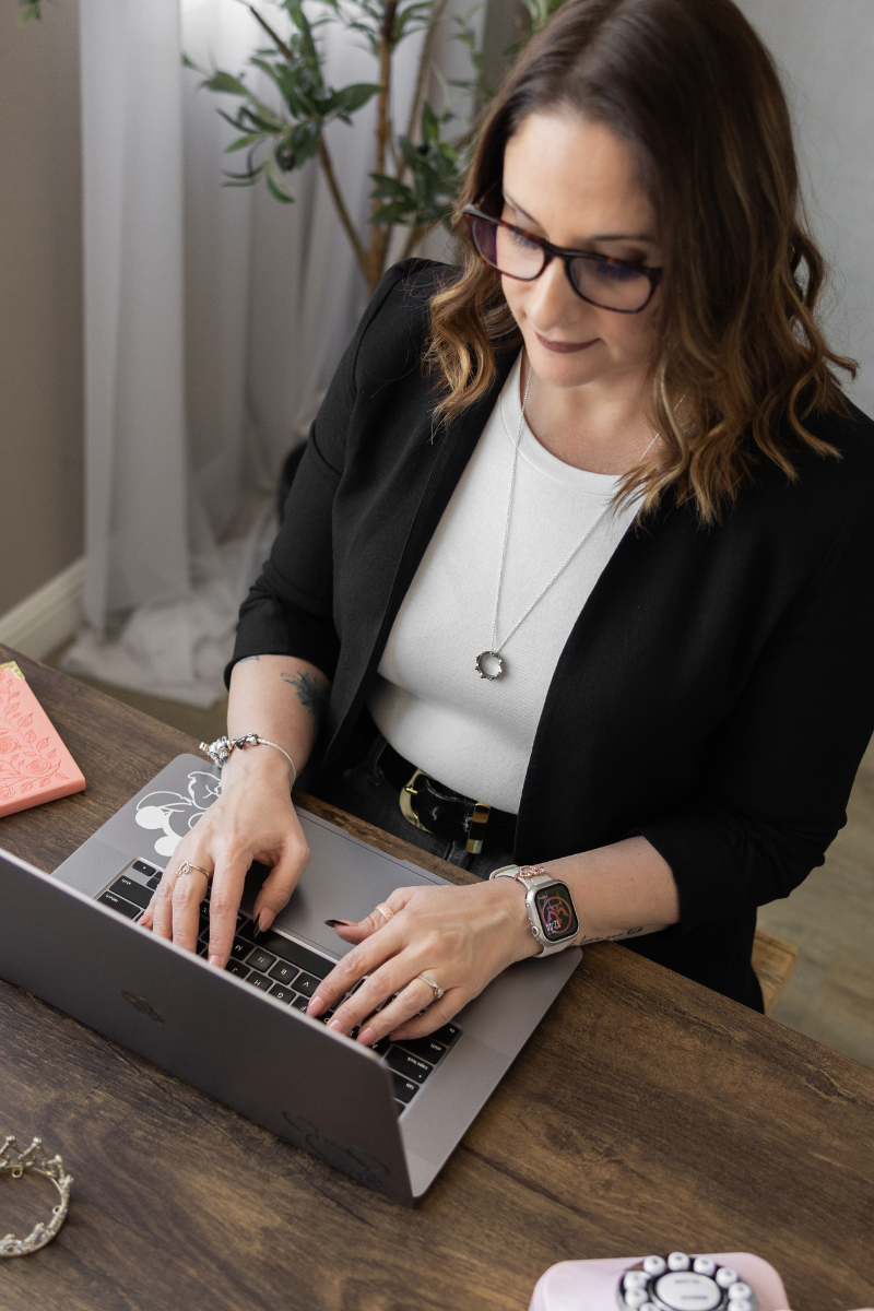 Small business operations specialist setting up automated workflows on a laptop
