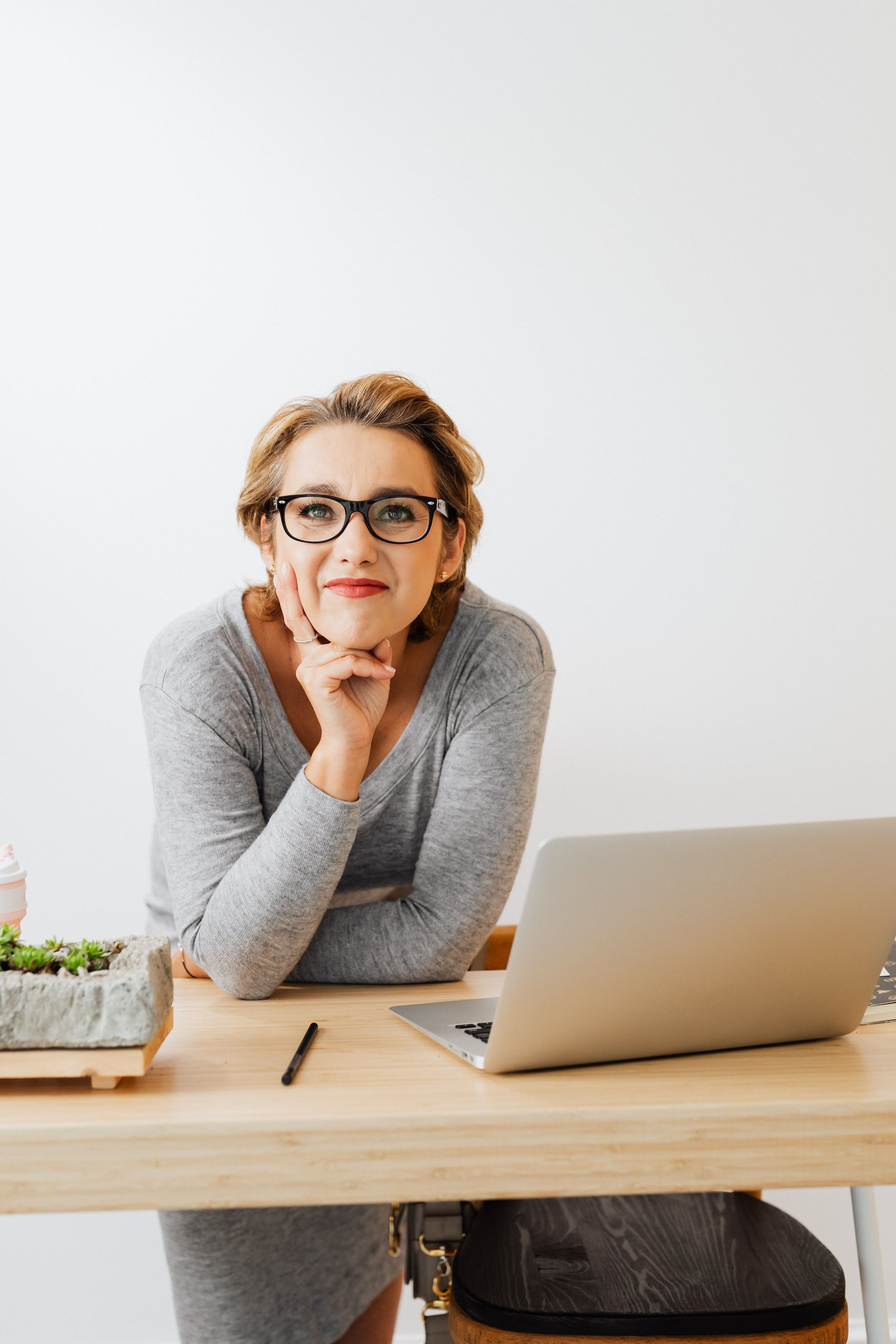 a small business owner looking relaxed and confident, not buried in their website