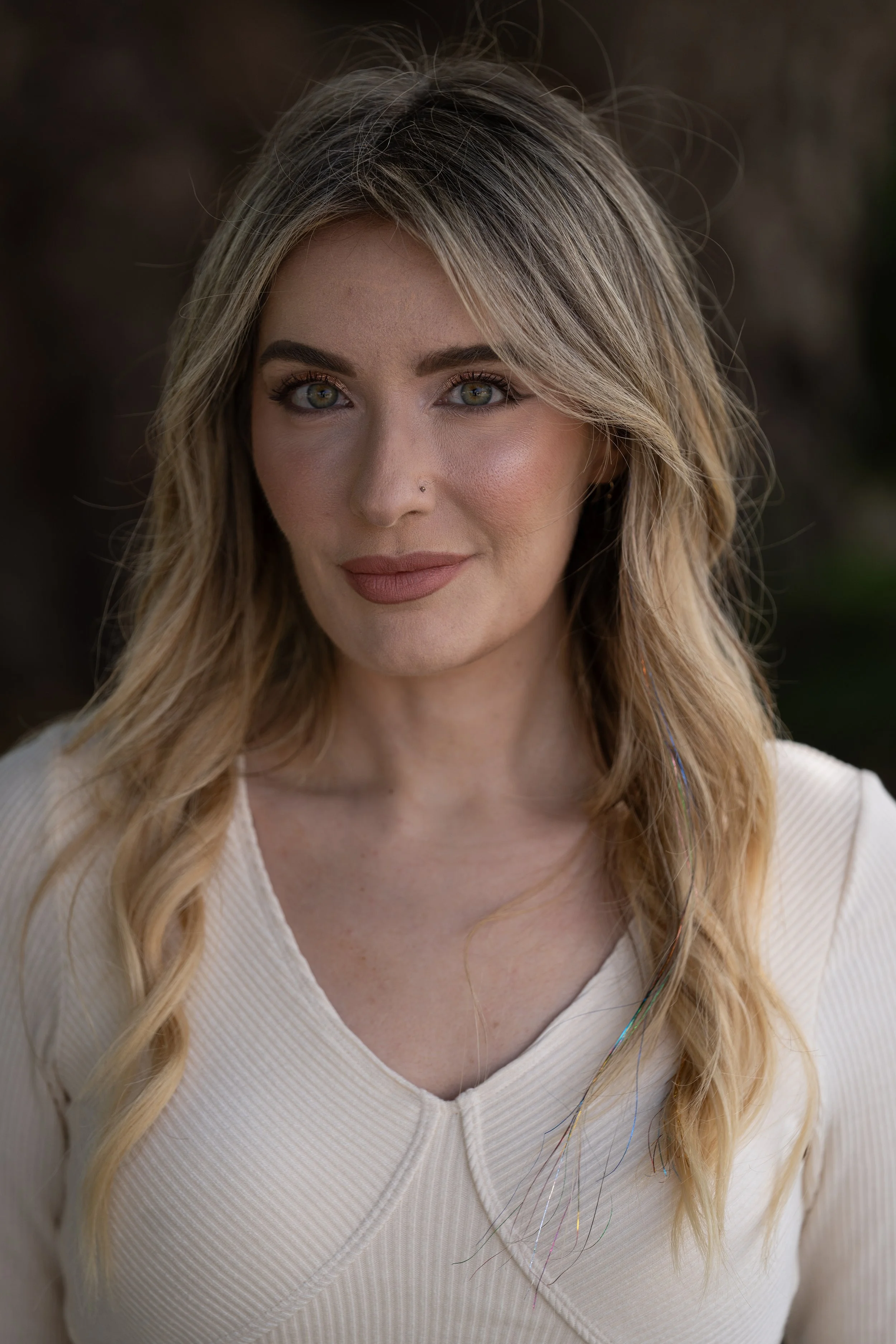 A professional portrait sample showcasing AI-assisted skin retouching and detail enhancement using Evoto and Photoshop for a polished brand image.