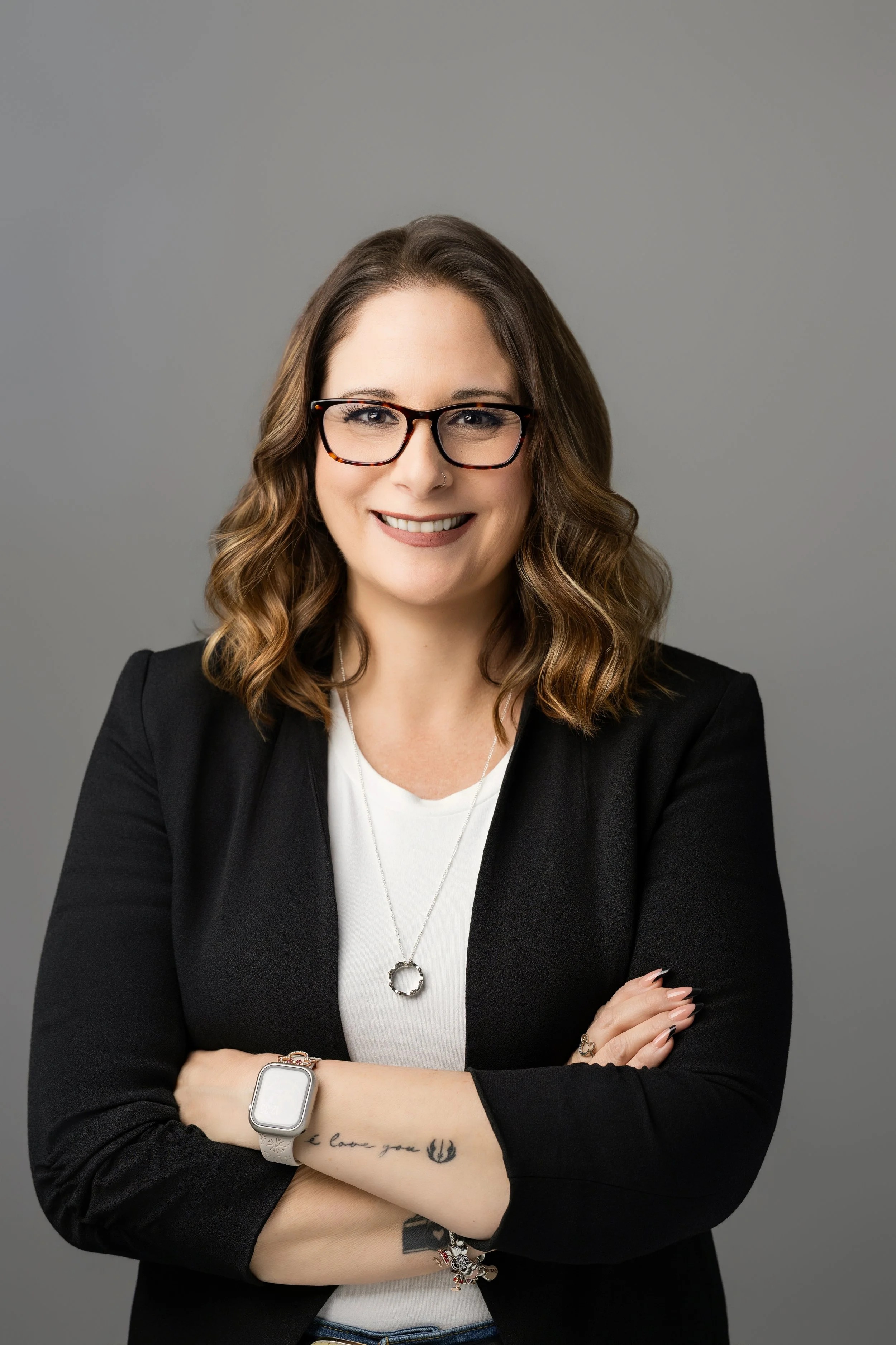 A professional portrait of Megan, a high-level VA and Business Architect who builds the operational engine for creative entrepreneurs. She handles the technical heavy lifting so CEOs can actually scale without the manual scramble.