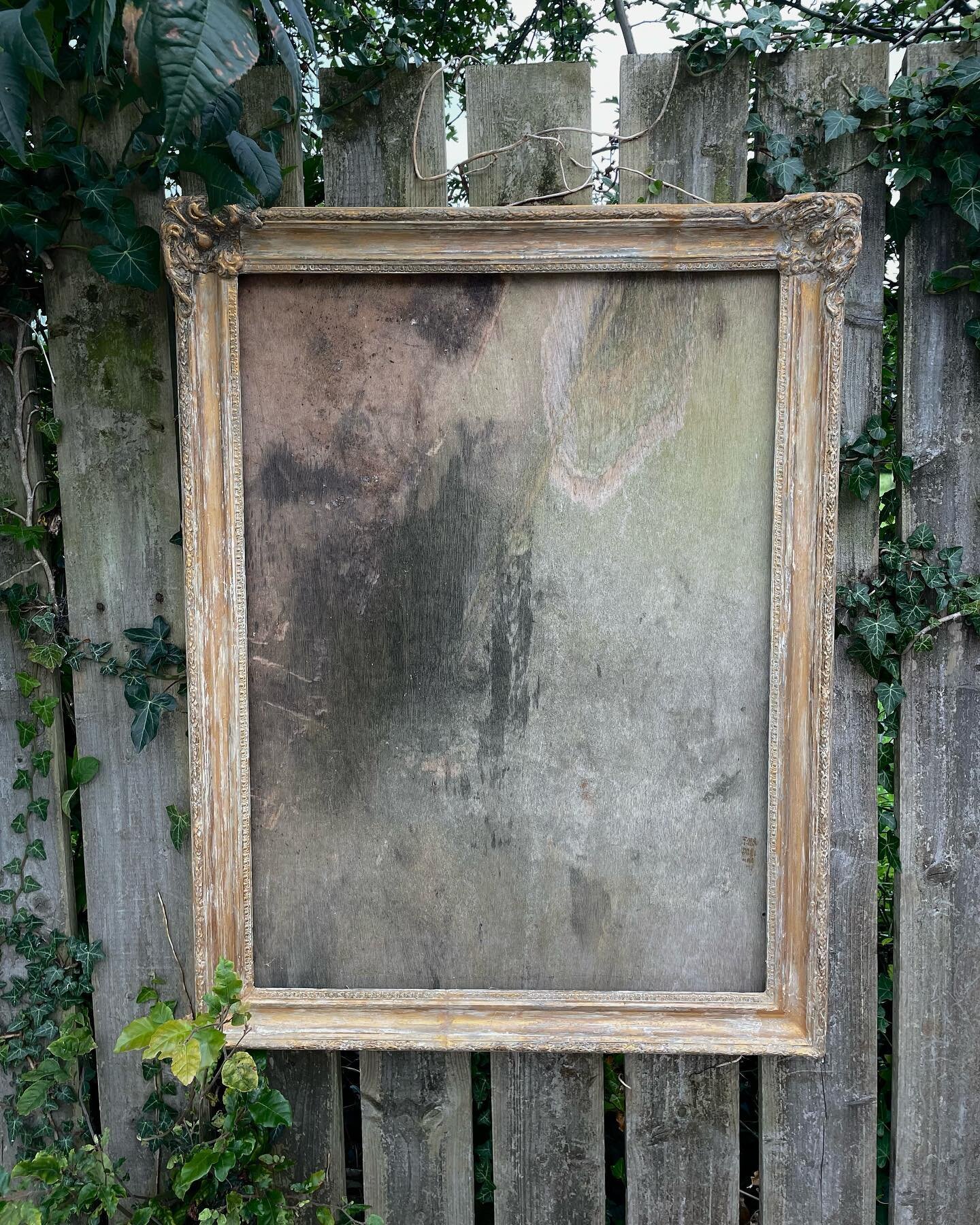 part restored antique frame found in pieces in a skip w a thick coat of white paint. stripped it back, cut it to a rectangle then moulded and cast the intact areas to replace all broken parts. 

was going to restore back to full gold but i liked the 