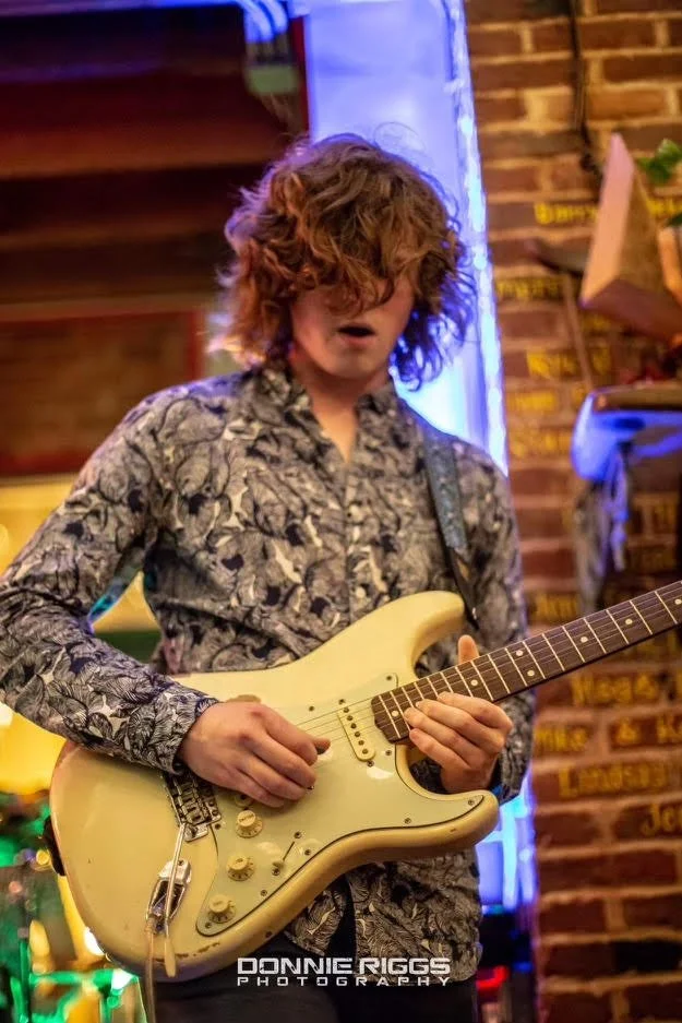Guitar instructor John Frommelt playing electric guitar, Takoma Music School