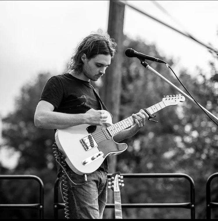 Graeme Leddy, guitar and songwriting instructor at Takoma Music School in Takoma Park, MD, playing guitar live.