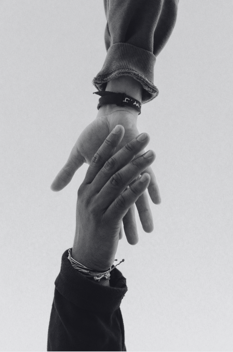 Two hands reaching out to each other