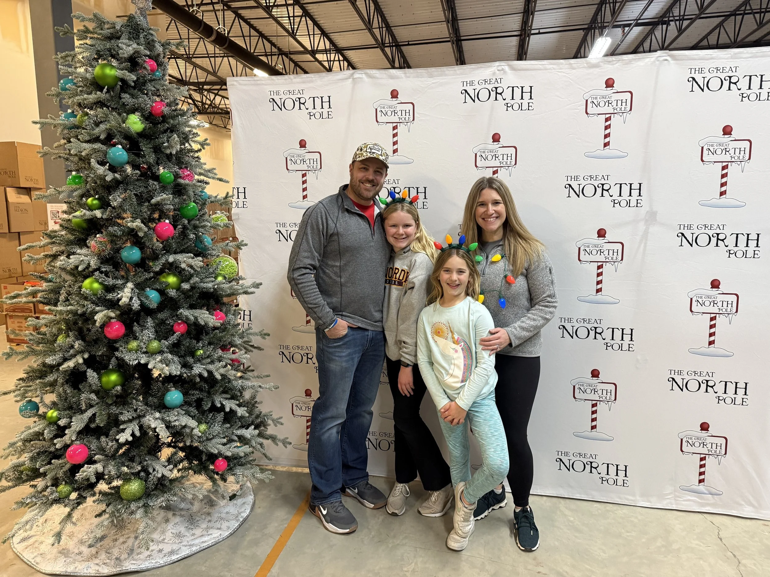 Andrew, Mallory, Brooklyn and Justine Pringle at The Great North Pole packing facility