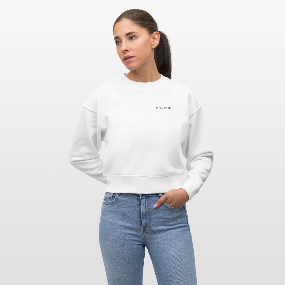 Young female in a cropped white sweatshirt
