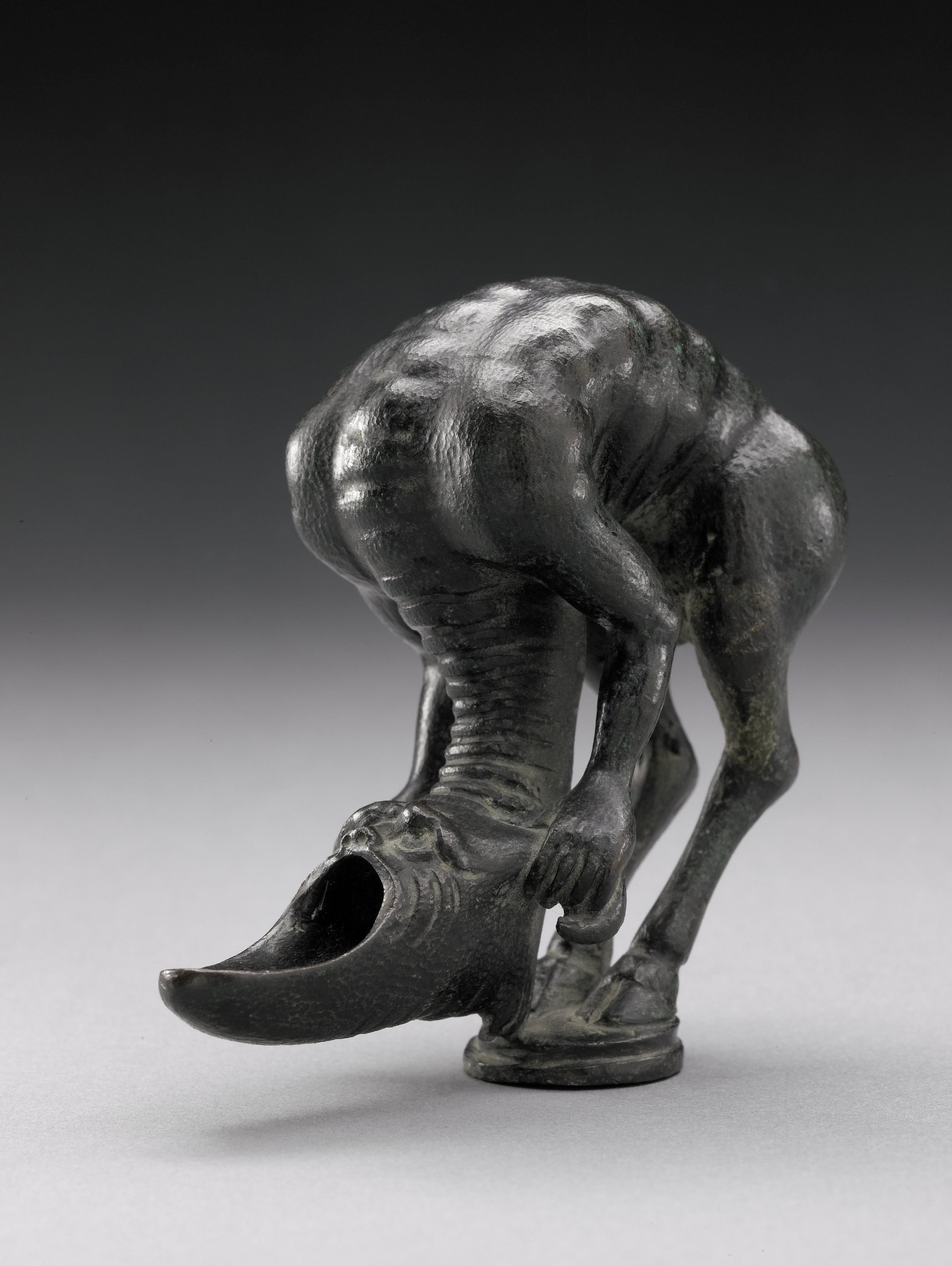 21. A CONTORTED BEAST WITH SELF-HELD HEAD, UNKNOWN CENTURY