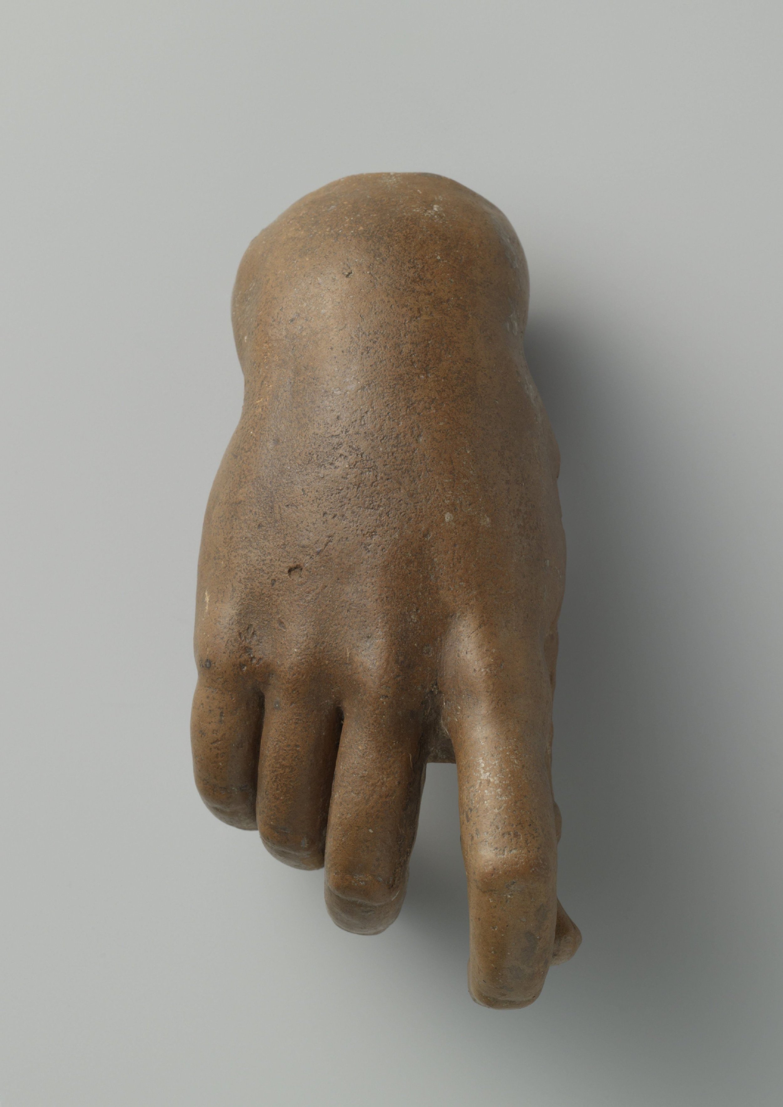 25. A HAND CARVED IN SANDSTONE, LATE 17TH CENTURY