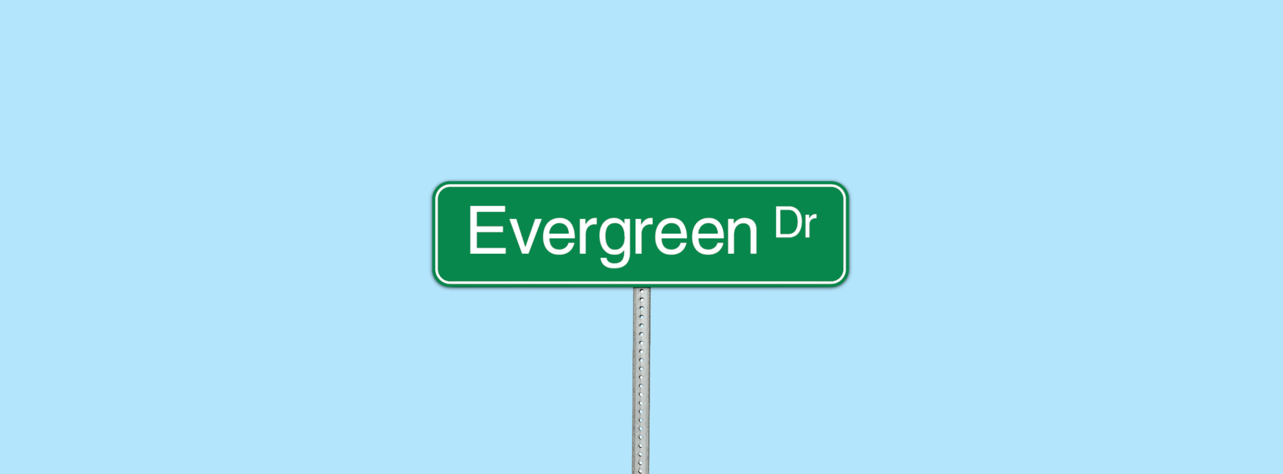 Green street sign that reads 'Evergreen Dr' against a light blue sky background.