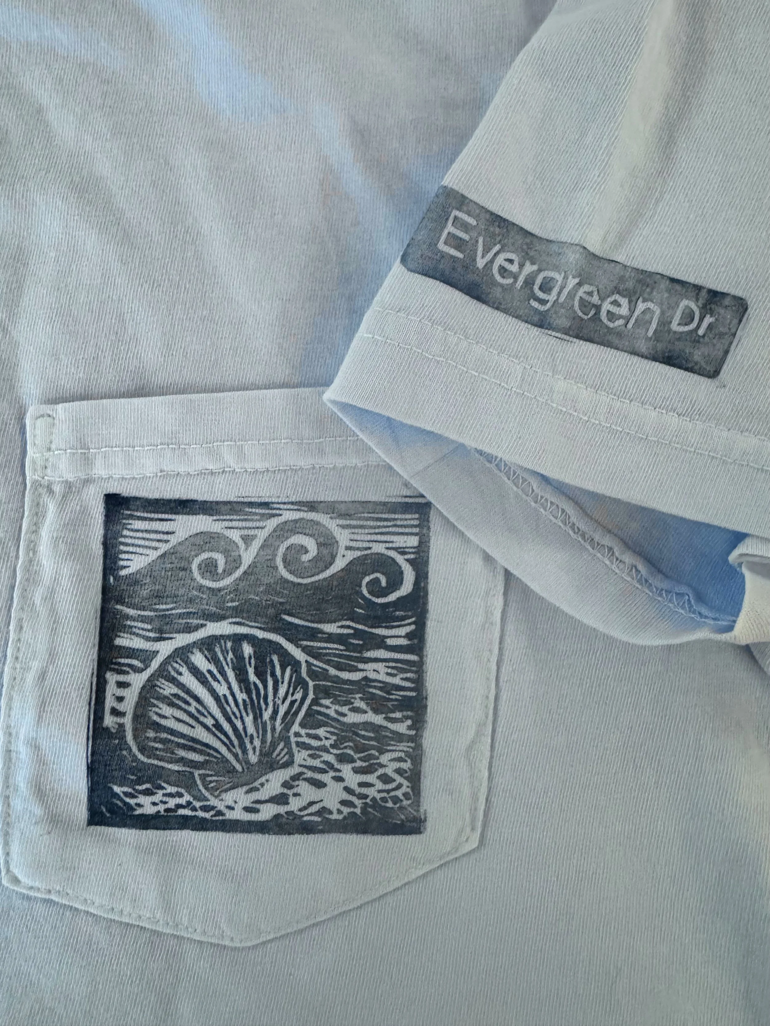 shell-and-waves-linocut-print-pocket-t-shirt.jpg